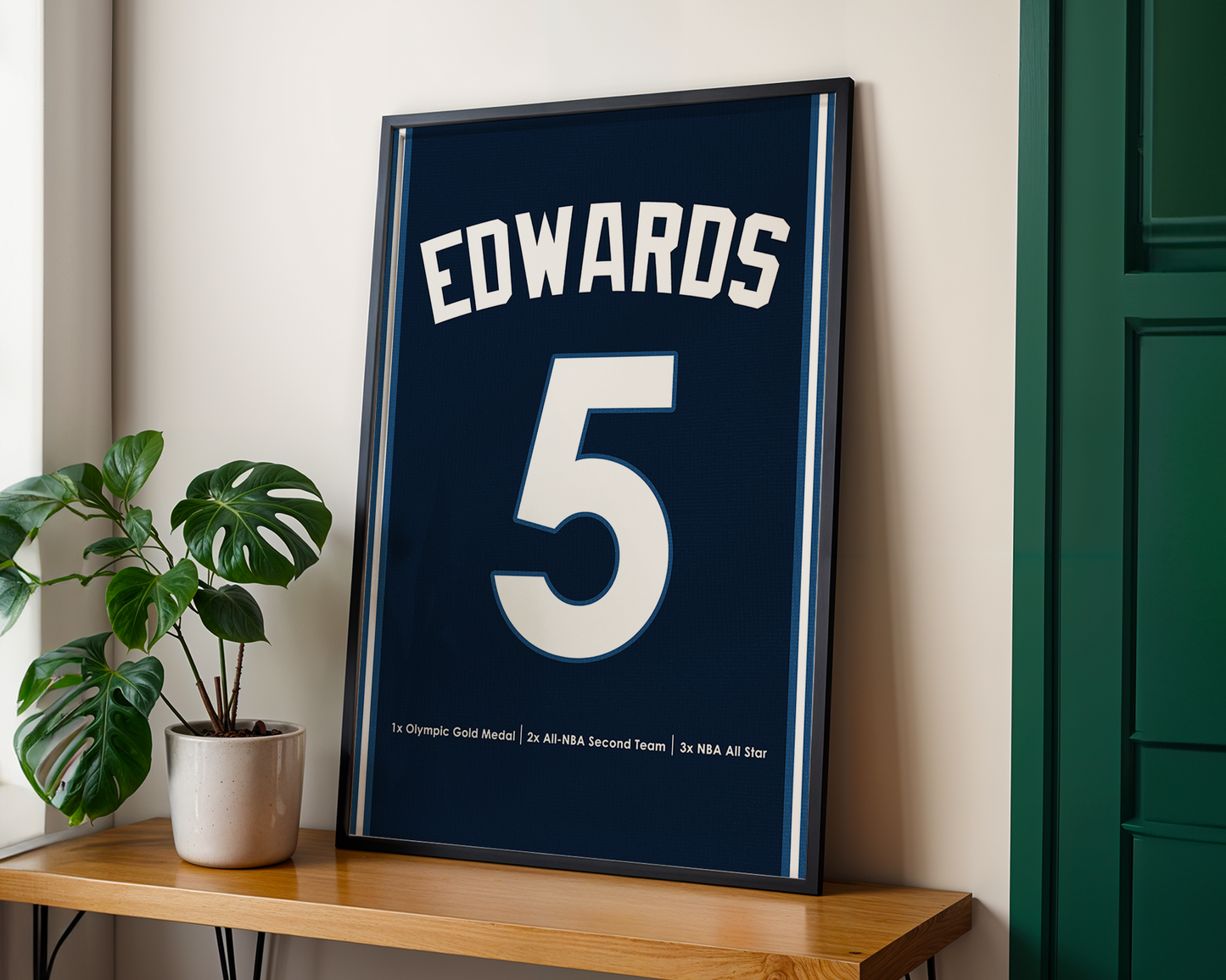 Framed sports jersey with 'EDWARDS' and number '5' on a wooden shelf.