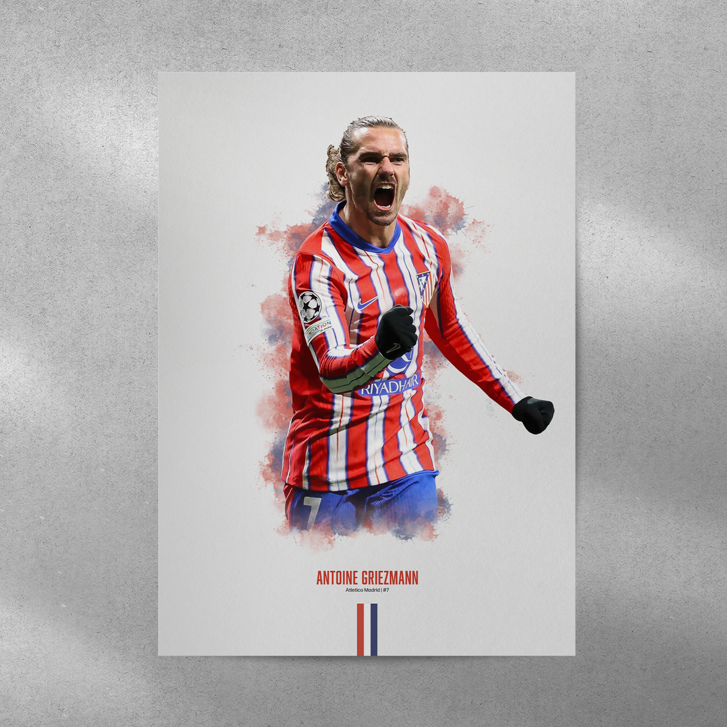poster mockup on a grey wall. poster of soccer player antoine griezmann celebrating for atletico madrid.