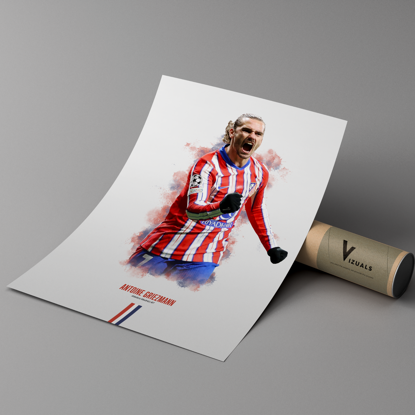 poster mockup leaning on a branded cardboard tube. poster of soccer player antoine griezmann celebrating for atletico madrid.