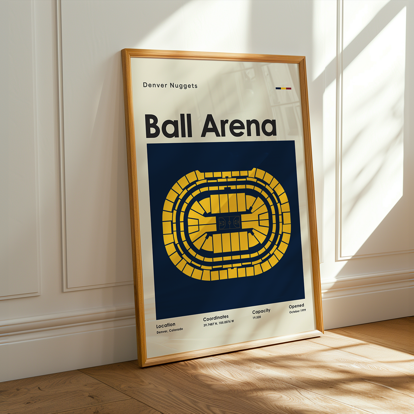 Framed poster of Ball Arena with Denver Nuggets logo on a wooden floor.