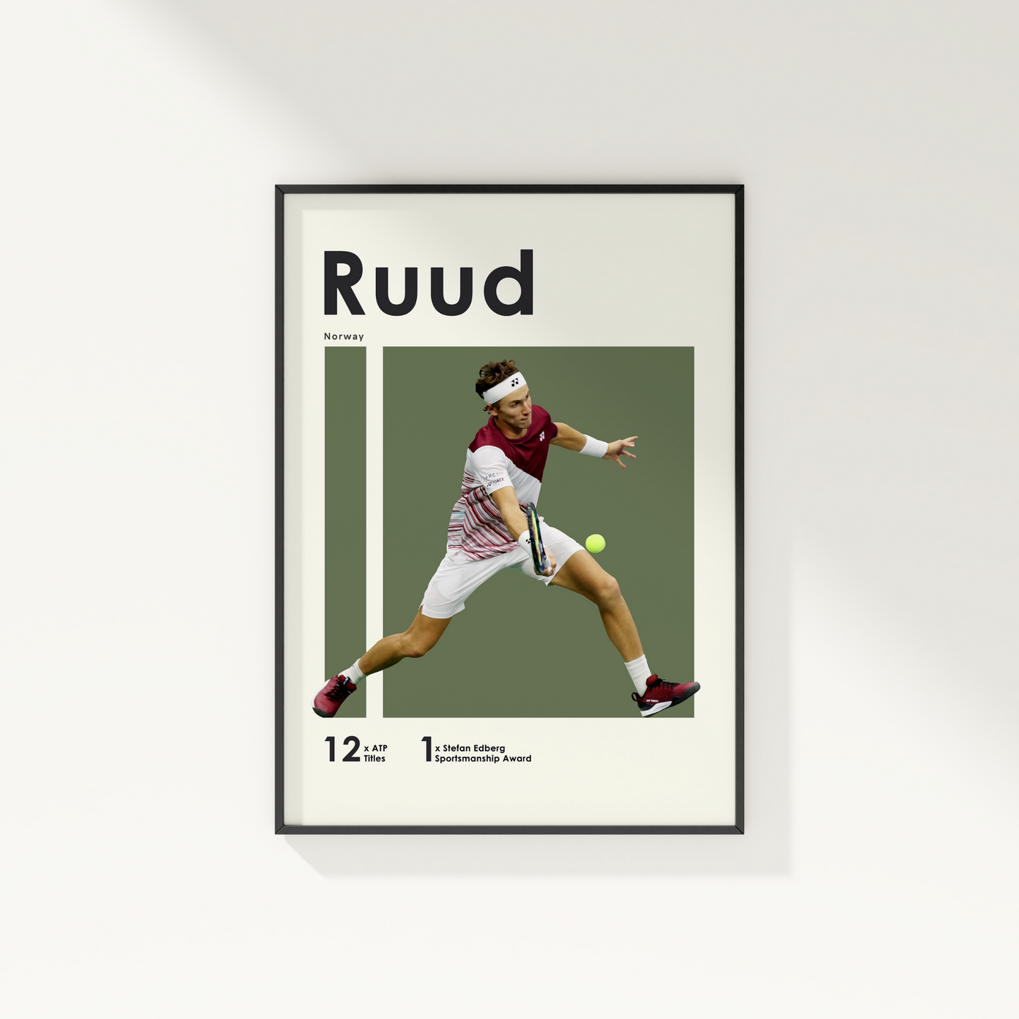 framed poster mockup hanging on a white wall. poster of tennis player Casper Ruud hitting a volley.