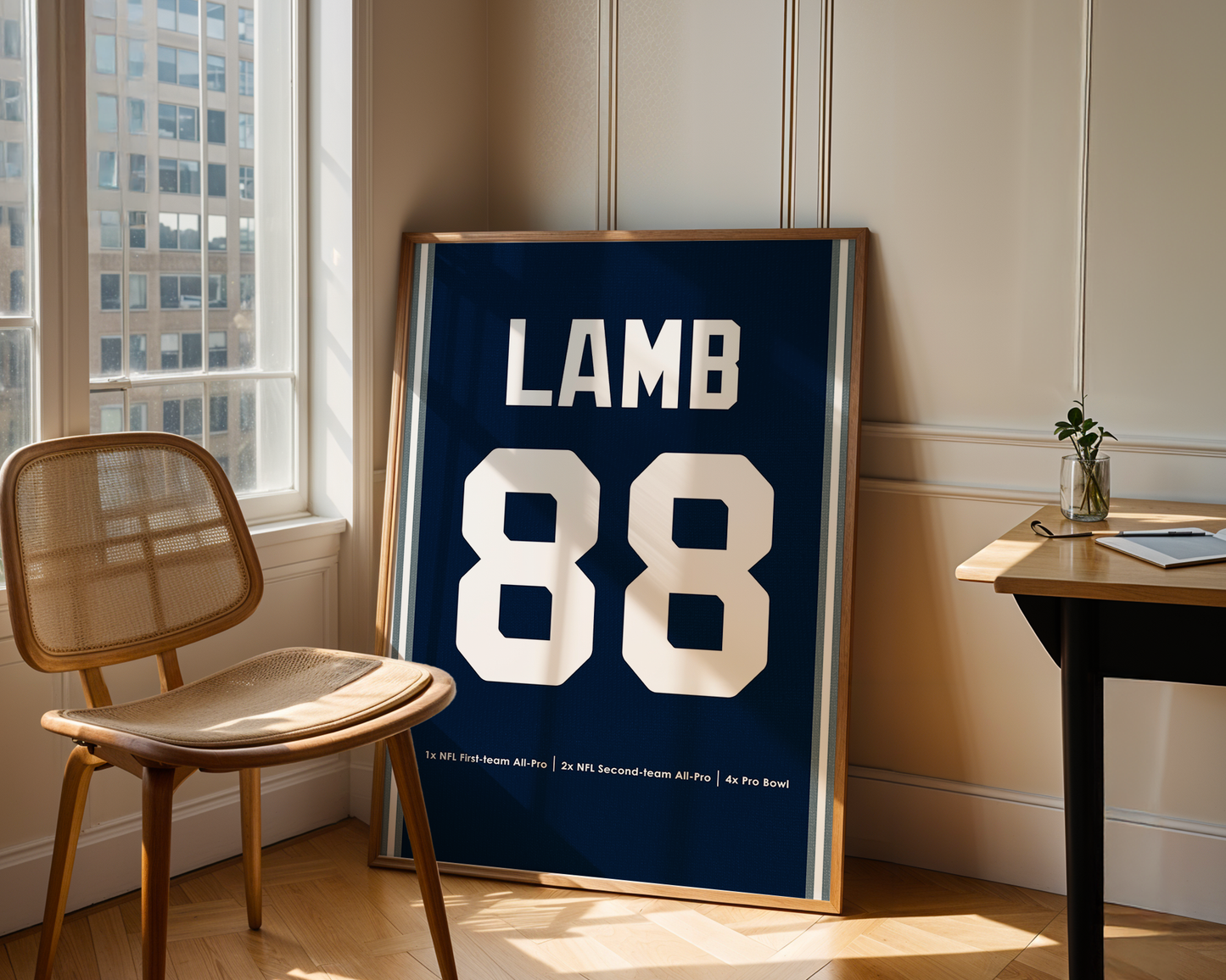 Framed sports jersey with 'LAMB 88' in a room with a window and chair.