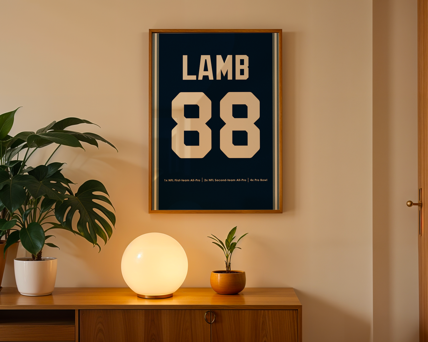Framed poster with 'LAMB 88' on a wall above a wooden cabinet with decorative items.