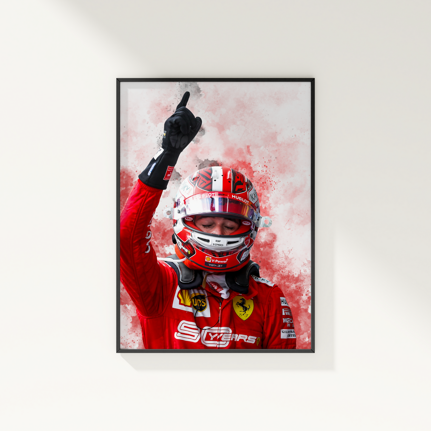 framed poster mockup hanging on a white wall. poster of formula 1 driver charles leclerc celebrating for ferrari.