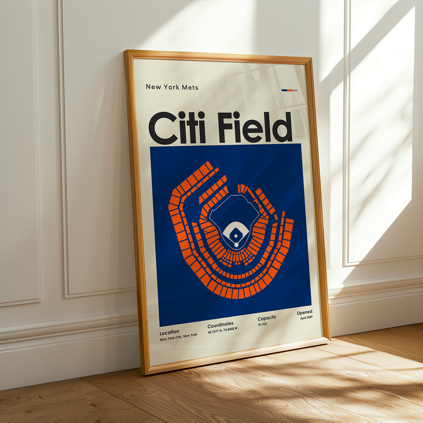 Framed poster of Citi Field with a wooden frame on a light-colored wall.