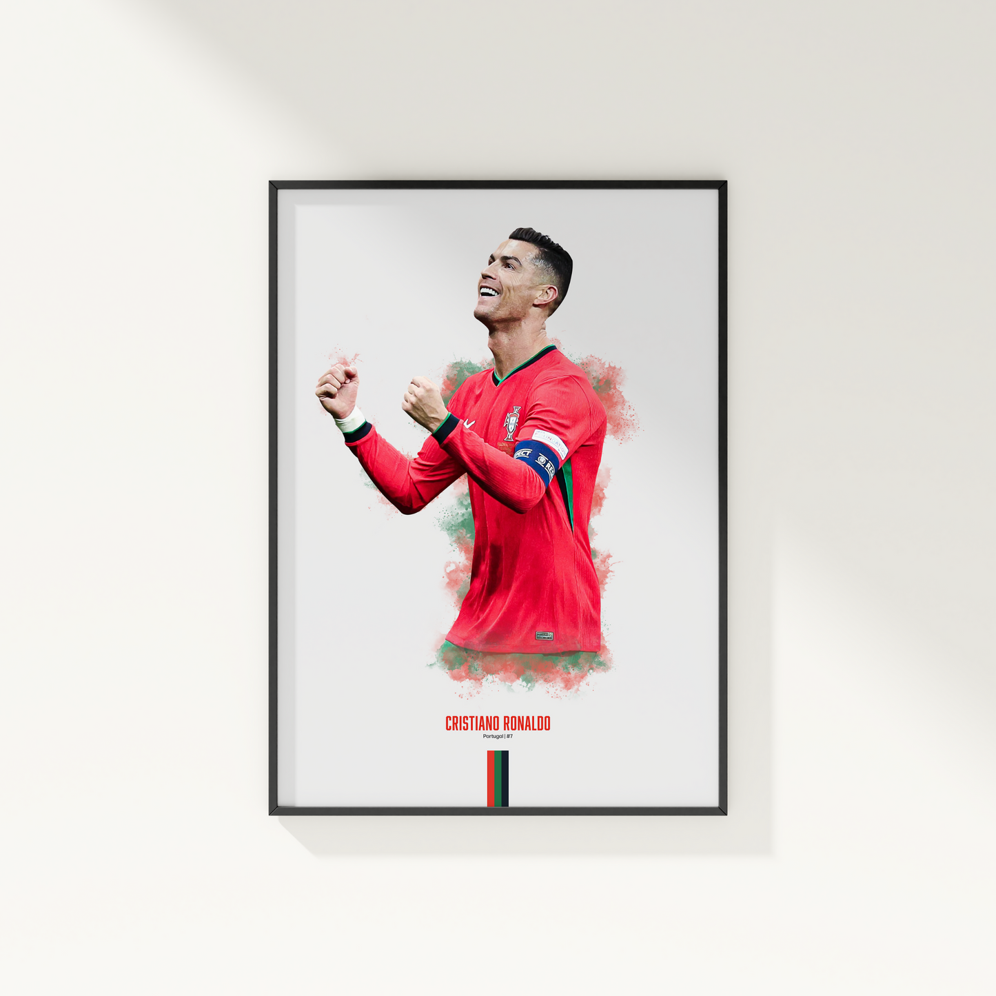 framed poster mockup hanging on a white wall. poster of soccer player cristiano ronaldo celebrating for Portugal.
