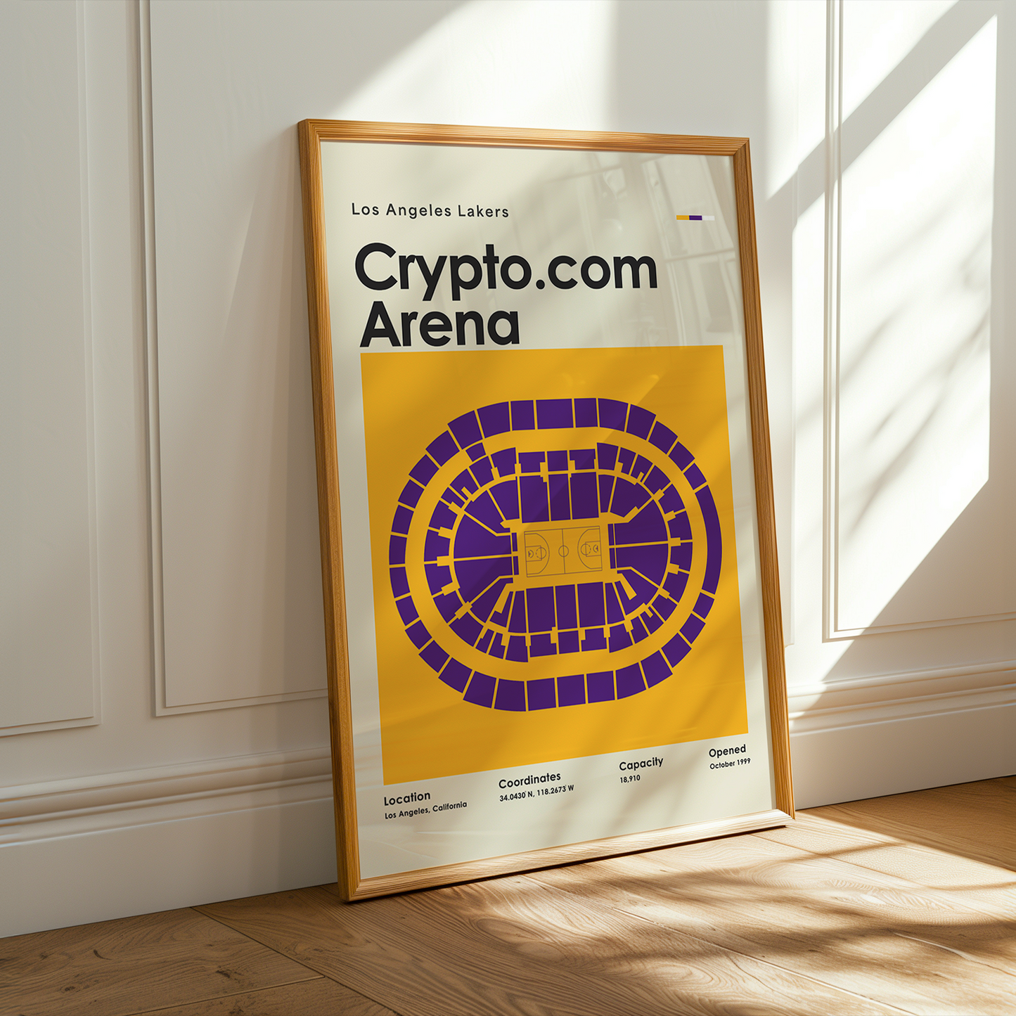 Framed poster of Crypto.com Arena with Los Angeles Lakers branding on a wall.