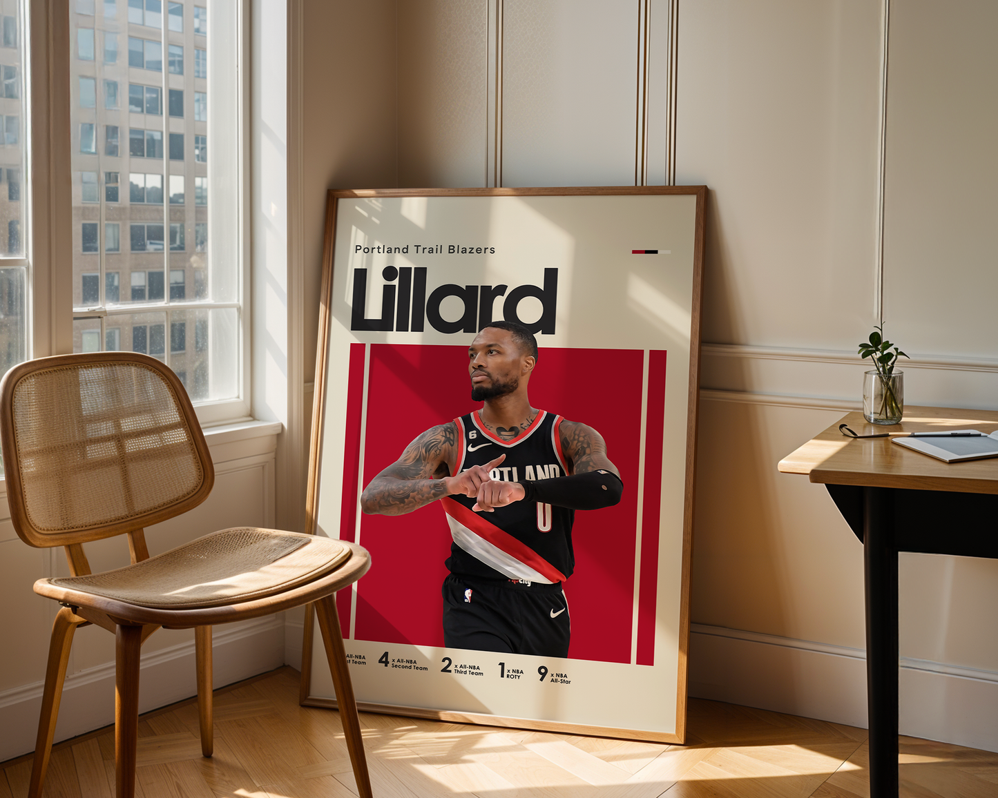 Framed poster of a basketball player with 'Lillard' branding in a room with a chair and table.