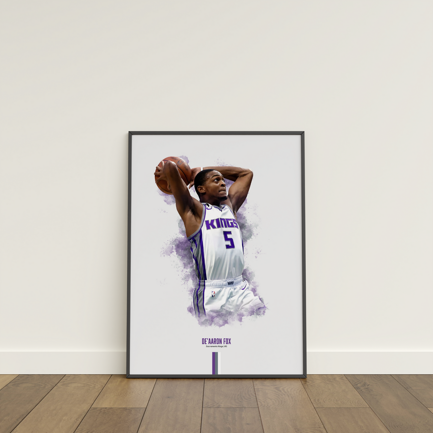 framed poster mockup leaning on a white wall. poster of basketball player de'aaron fox dunking for the Sacramento Kings.