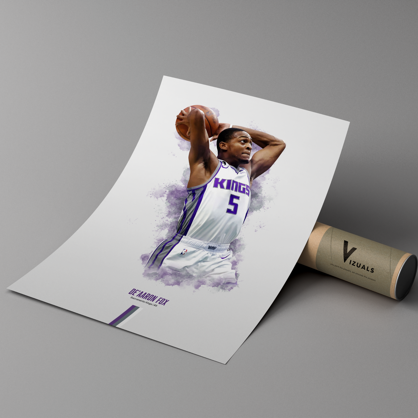 poster mockup leaning on a branded cardboard tube. poster of basketball player de'aaron fox dunking for the Sacramento Kings.
