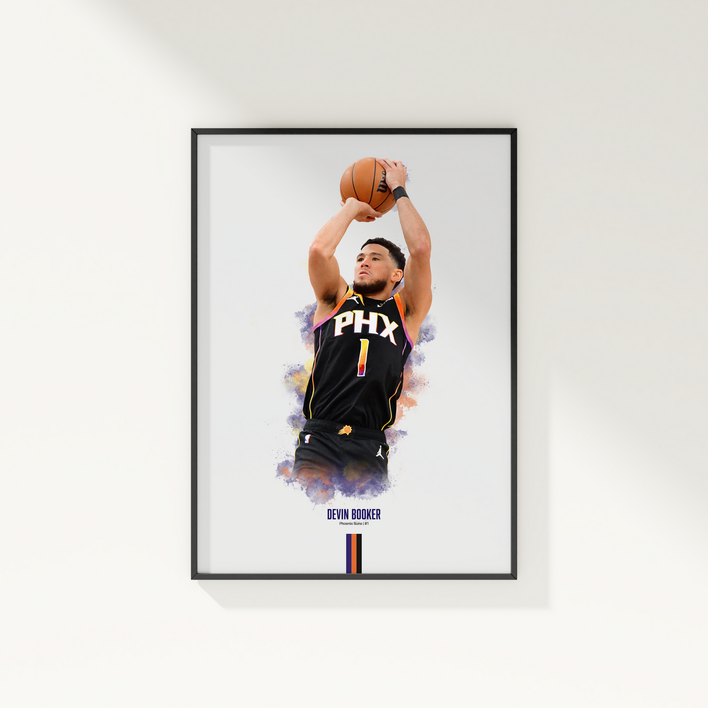 framed poster mockup hanging on a white wall. poster of basketball player devin booker shooting for the Phoenix Suns.