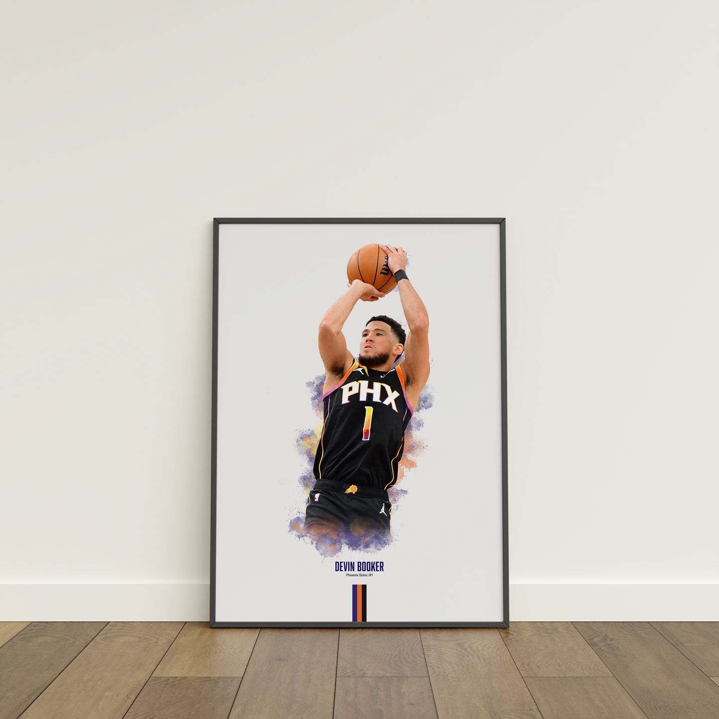 framed poster mockup leaning on a white wall. poster of basketball player devin booker shooting for the Phoenix Suns.