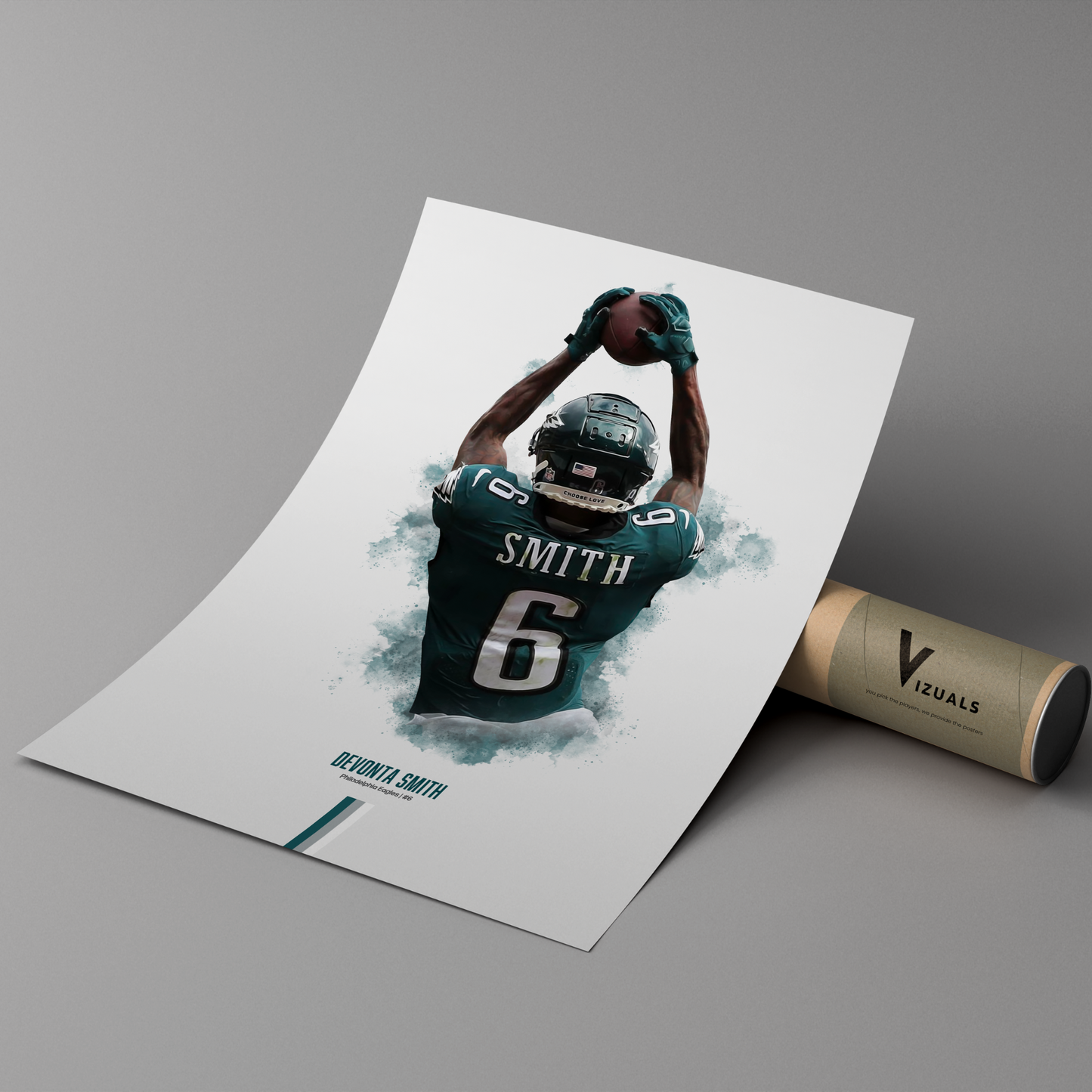 poster mockup leaning on a branded cardboard tube. poster of football player devonta smith playing for the philadelphia eagles.