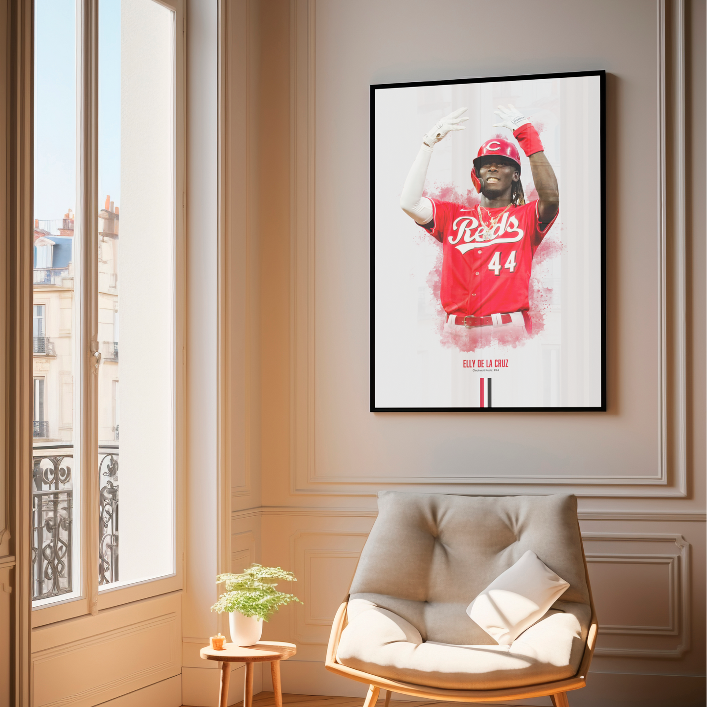 framed poster mockup hanging in a living room. poster of baseball player elly de la cruz celebrating for the cincinnati reds.