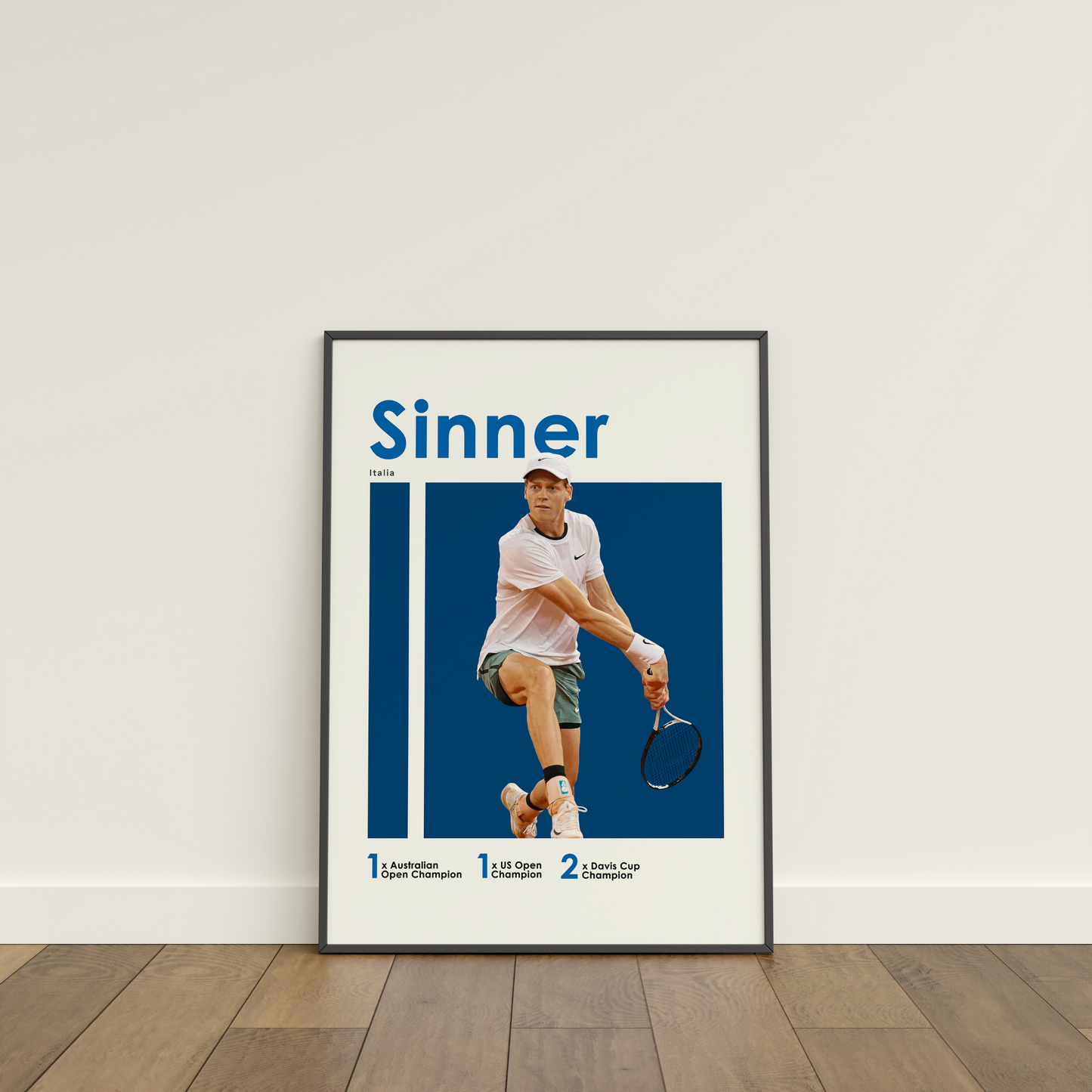 framed poster mockup leaning on a white wall. poster of tennis player jannik sinner.