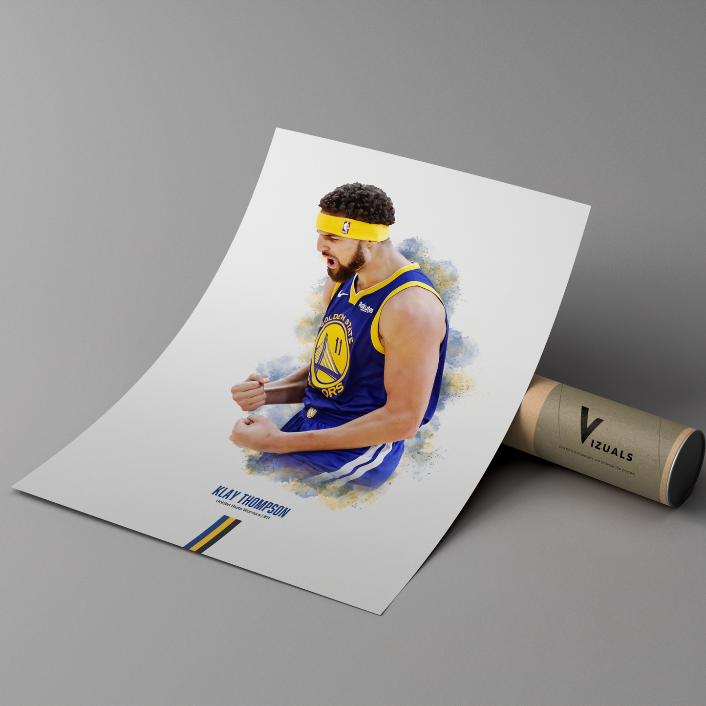 poster mockup leaning on a branded cardboard tube. poster of basketball player klay thompson celebrating for the golden state warriors.