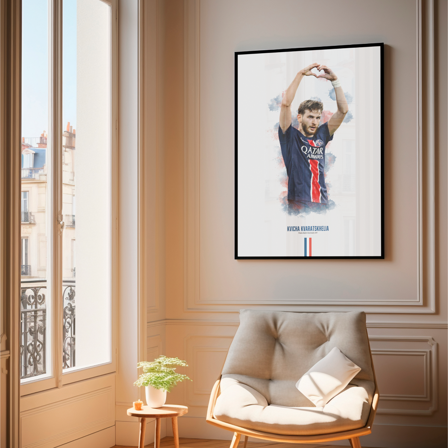 Framed poster print of soccer player Kvicha Kvaratskhelia, wearing a PSG jersey, on a wall above a chair.