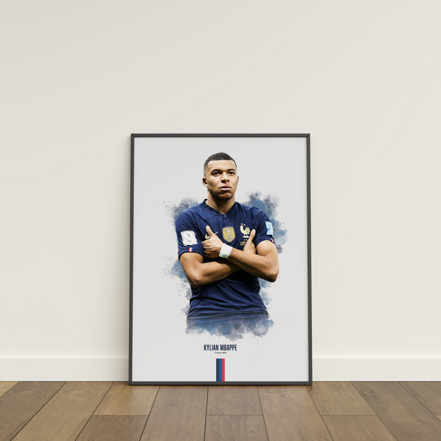 framed poster mockup leaning on a white wall. poster of soccer player Kylian Mbappe celebrating for France.