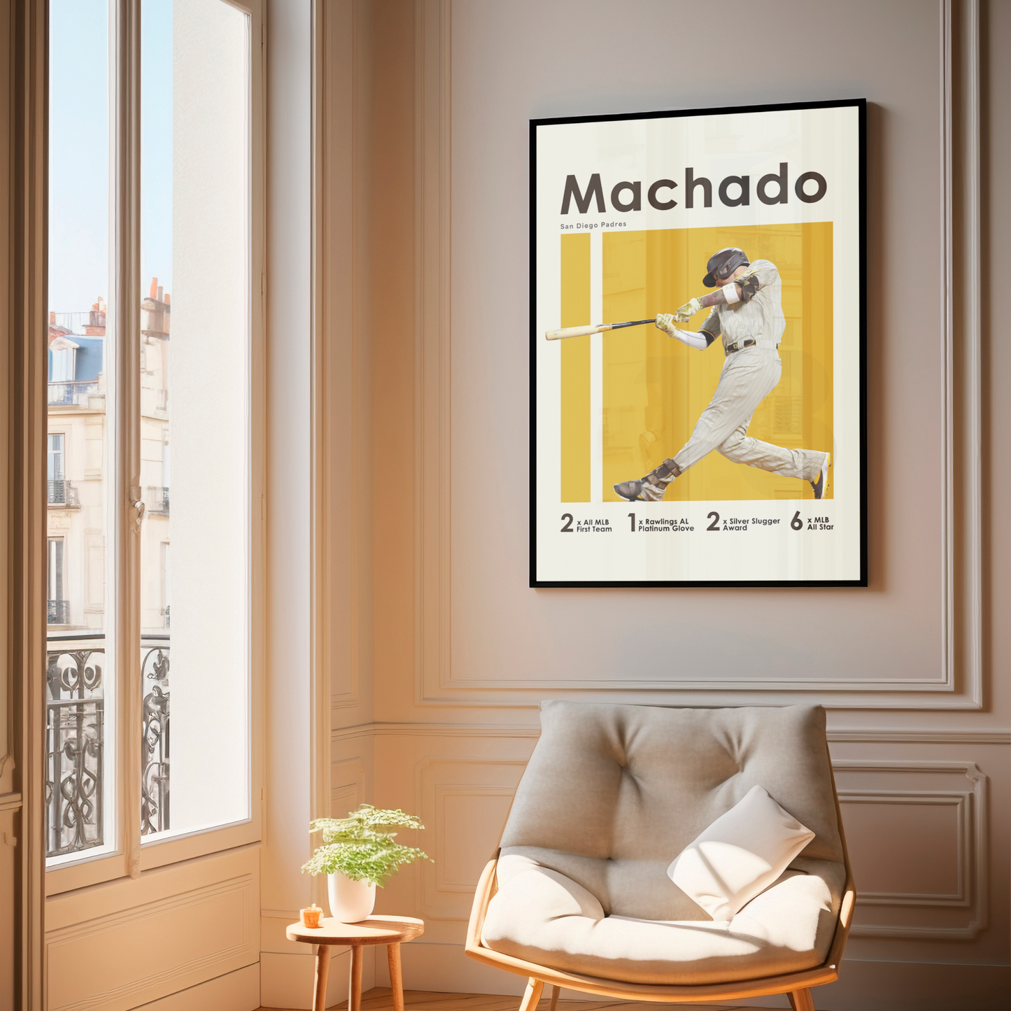 framed poster mockup hanging in a living room. poster of baseball player manny machado playing for the San Diego Padres.