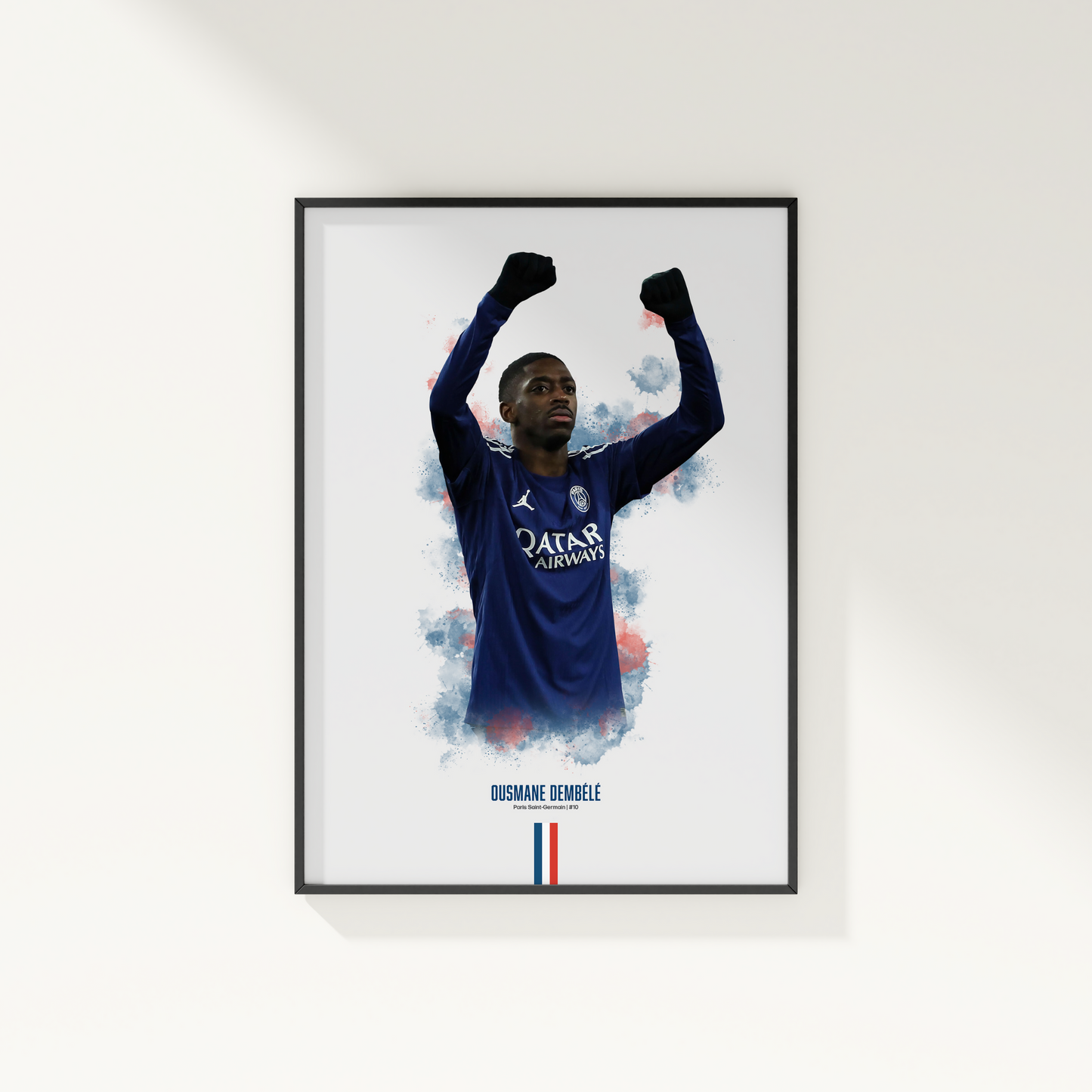 Framed poster print of soccer player Ousmane Dembele, wearing a PSG jersey, on a white wall.
