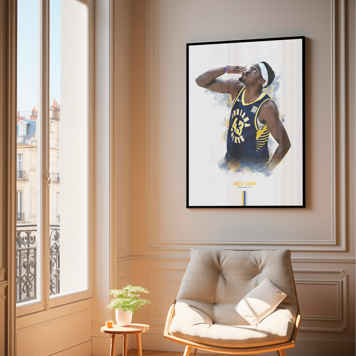 Framed poster of basketball player Pascal Siakam wearing a Pacers jersey on a wall above a chair.