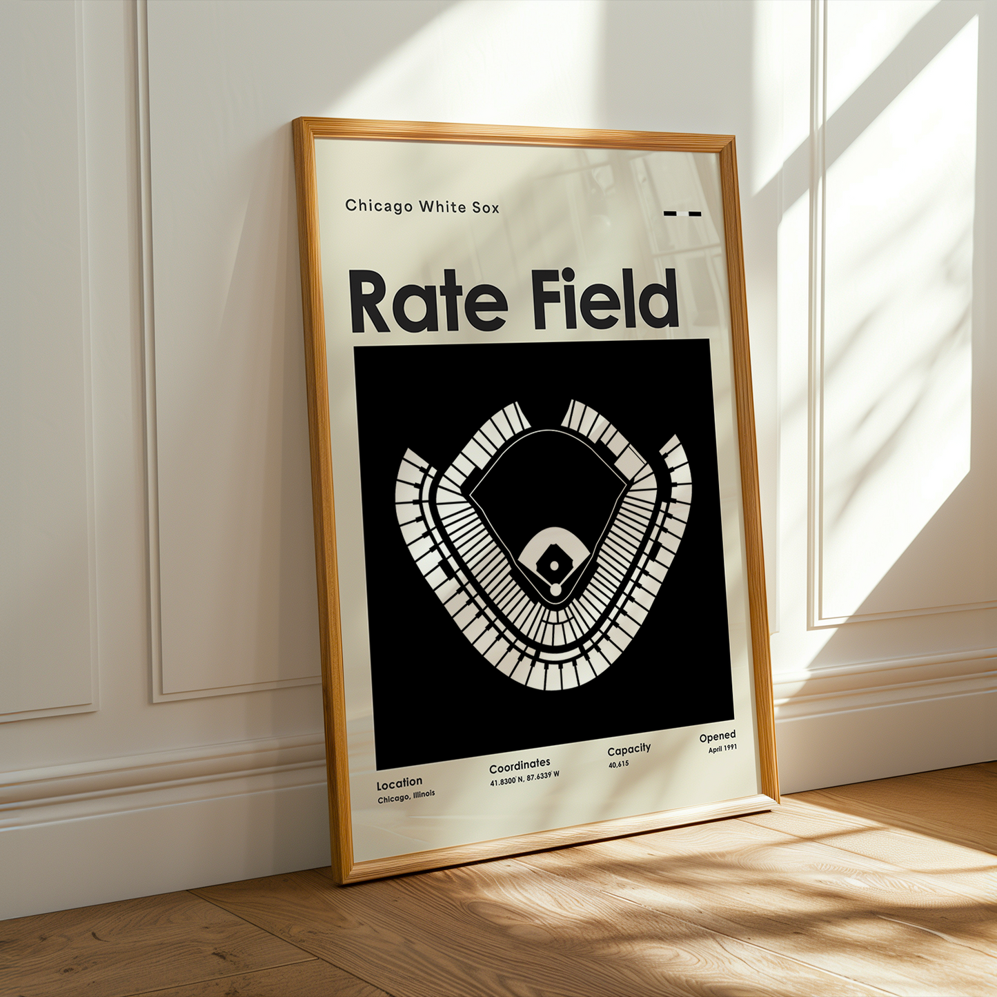 Framed poster of a baseball field design on a wall with sunlight casting shadows.