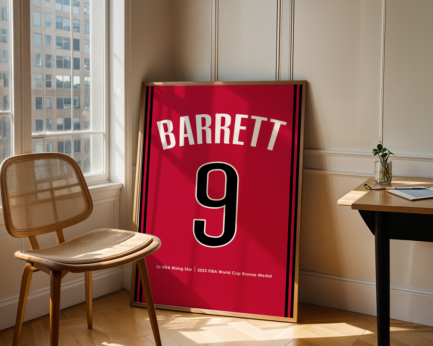 Red sports jersey with 'BARRETT' and number '9' in a room with a chair and table.