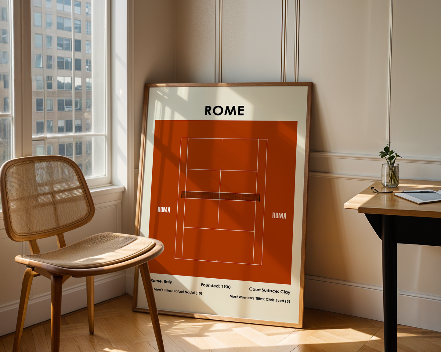 Framed poster of a tennis court design with 'Rome' text in a room with a chair and table.