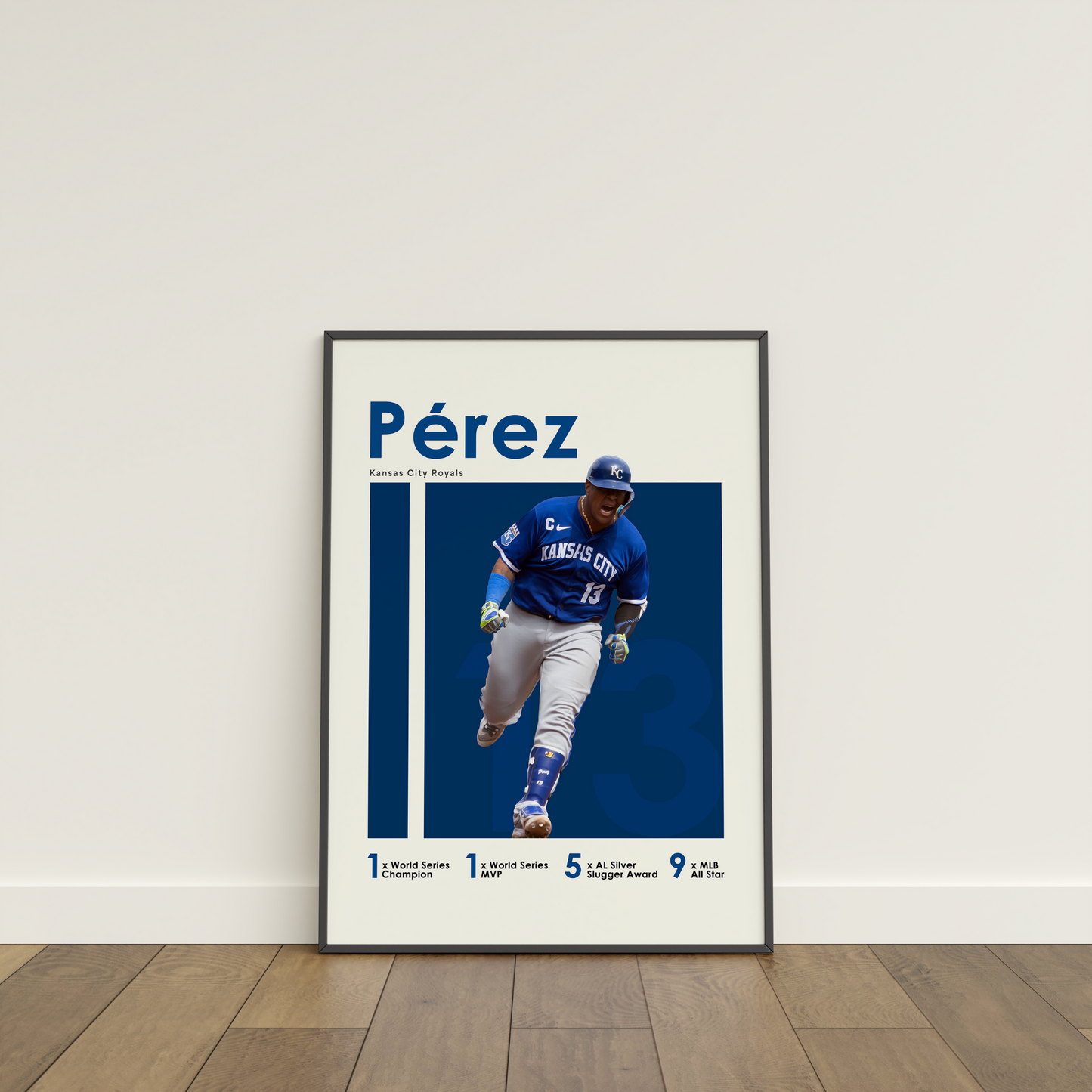 framed poster mockup leaning on a white wall. poster of baseball player salvador perez celebrating for the kansas city royals.