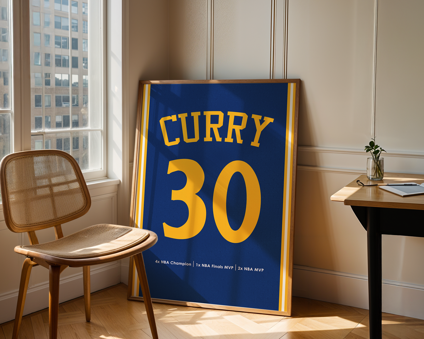 Framed sports jersey with 'Curry 30' in a room with a chair and table.