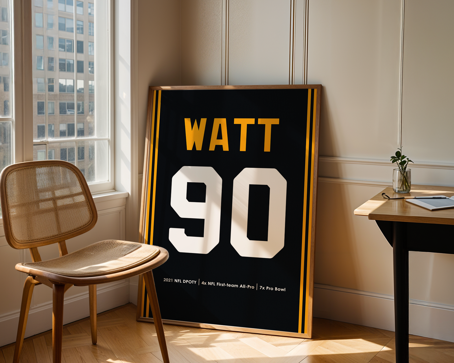 Framed sports jersey with 'Watt 90' in a room with a window and chair.