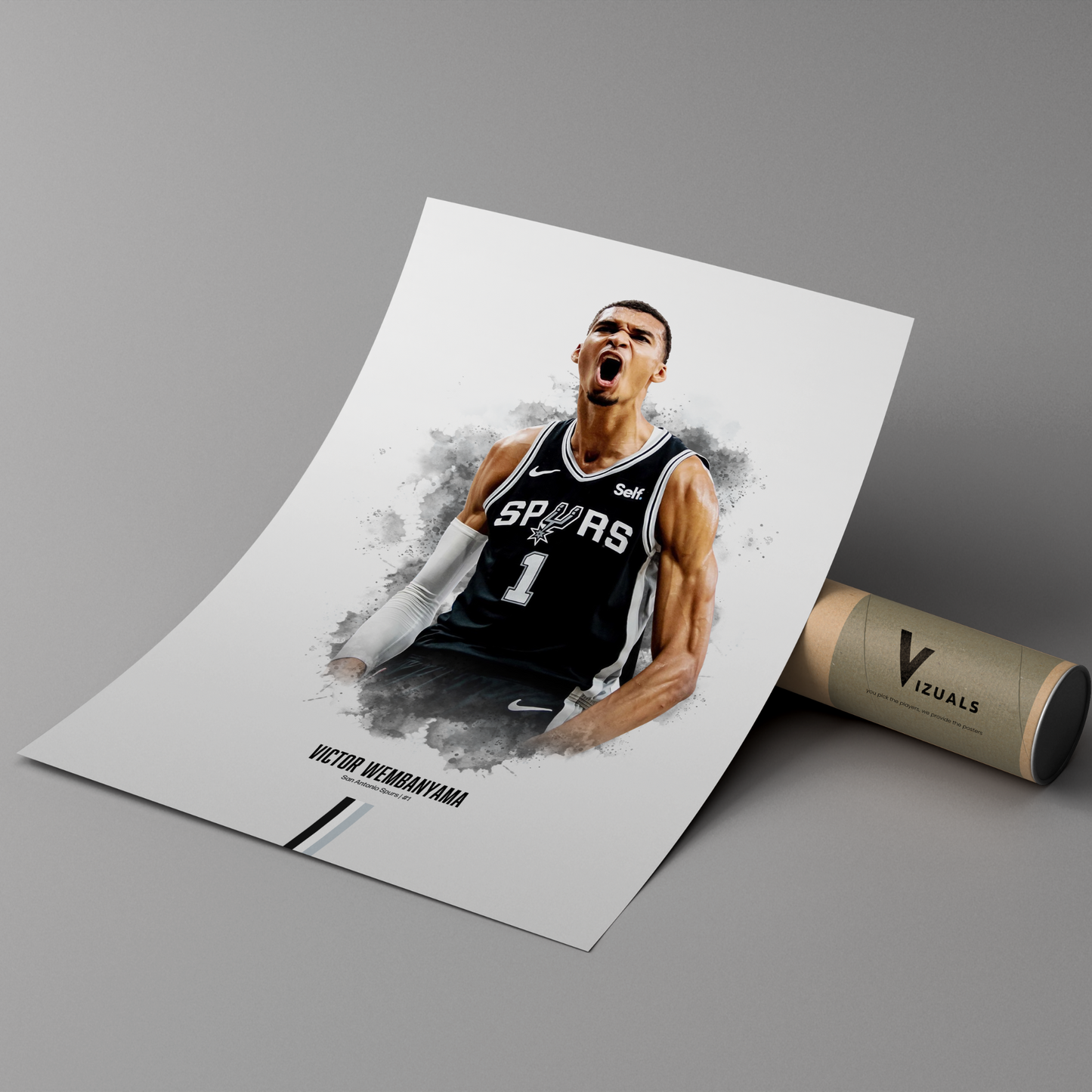 poster mockup leaning on a branded cardboard tube. poster of basketball player victor wembanyama celebrating for the san antonio spurs.