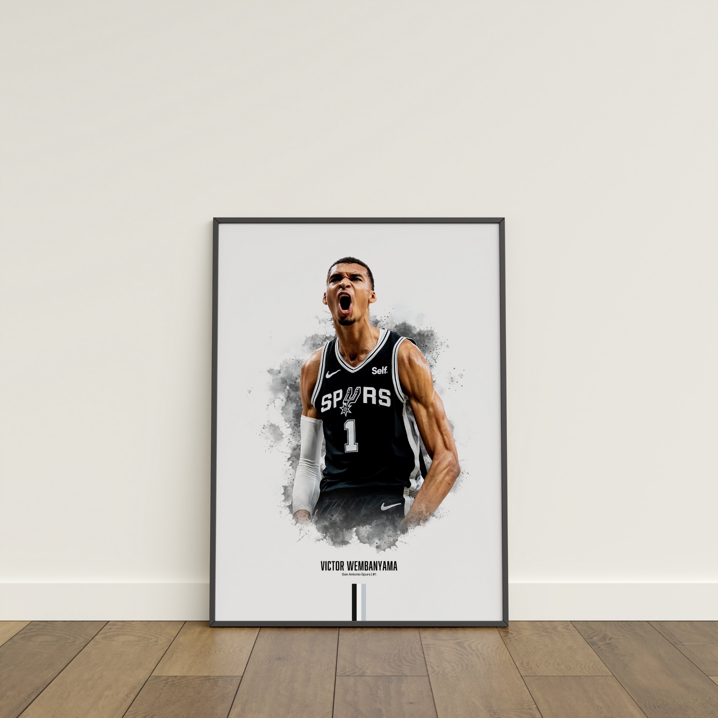 framed poster mockup leaning on a white wall. poster of basketball player victor wembanyama celebrating for the san antonio spurs.