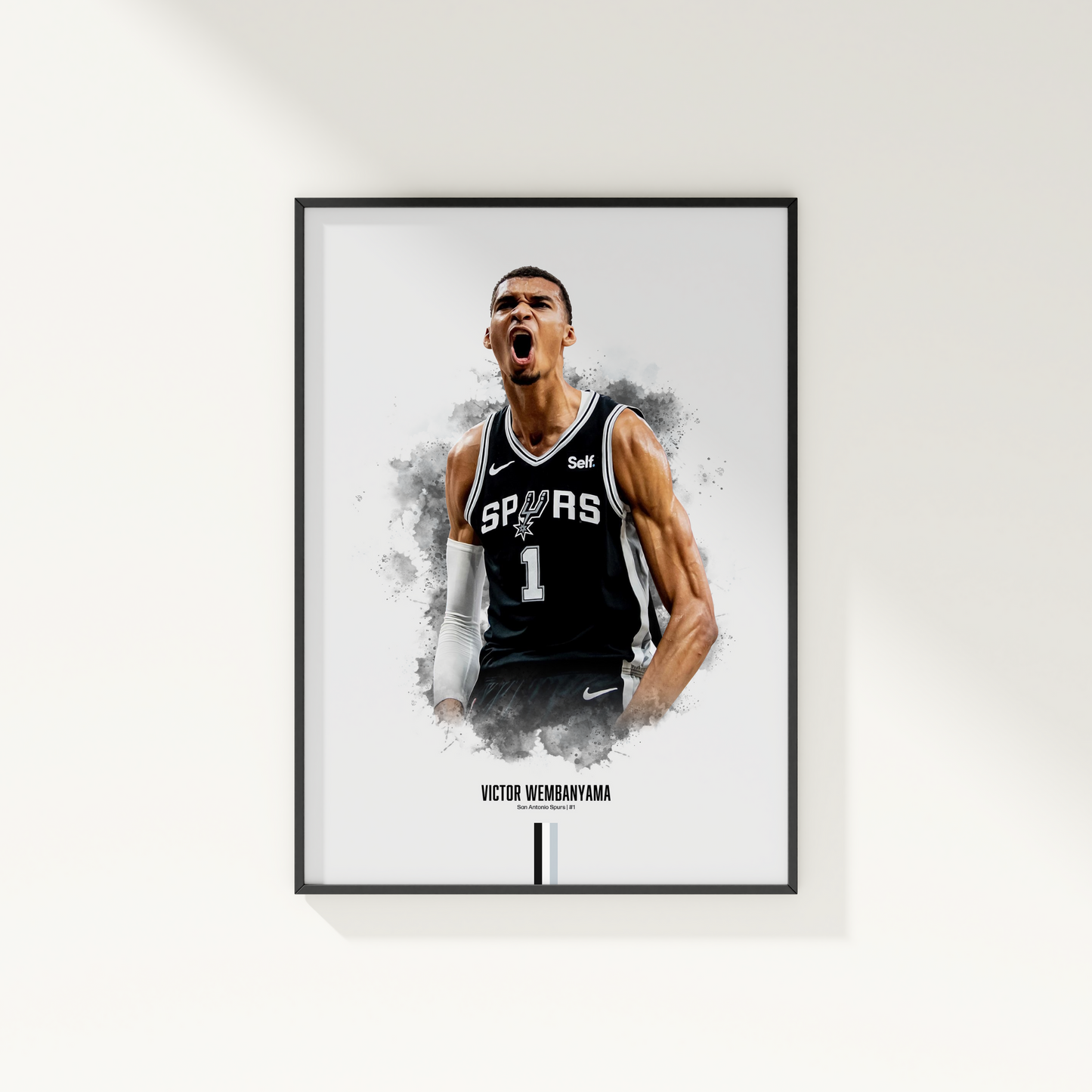 framed poster mockup hanging on a white wall. poster of basketball player victor wembanyama celebrating for the san antonio spurs.