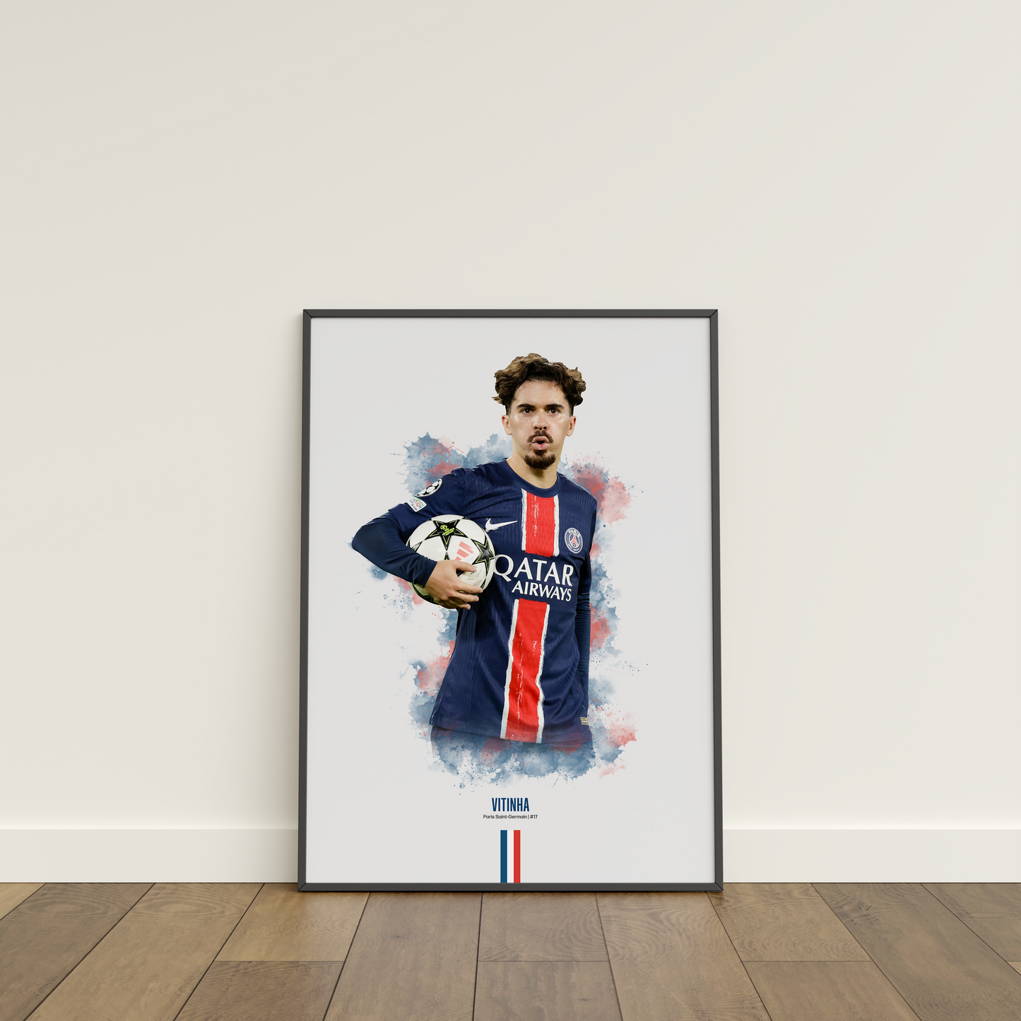 Framed poster print of soccer player Vitinha, wearing a PSG jersey, on a white wall.