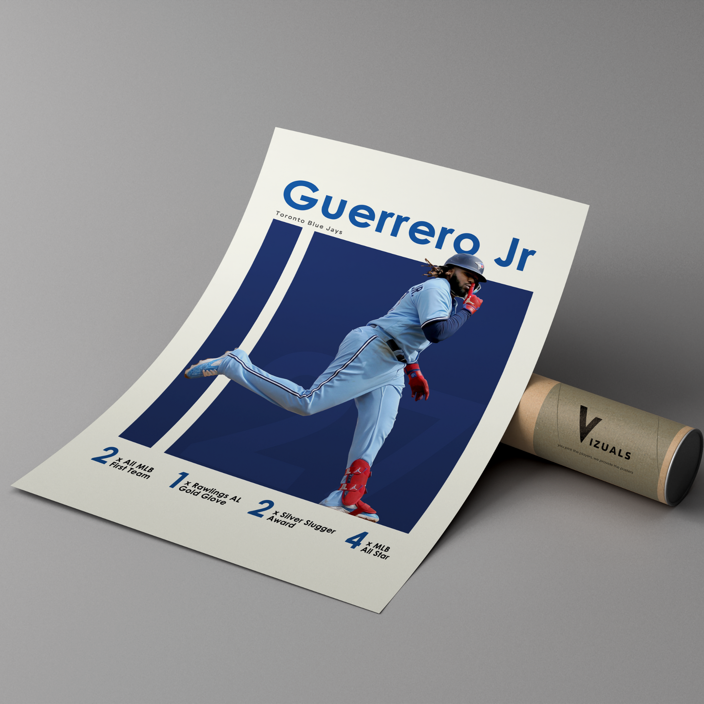 poster mockup leaning on a branded cardboard tube. poster of baseball player vladimir guerrero jr celebrating for the Toronto Blue Jays.