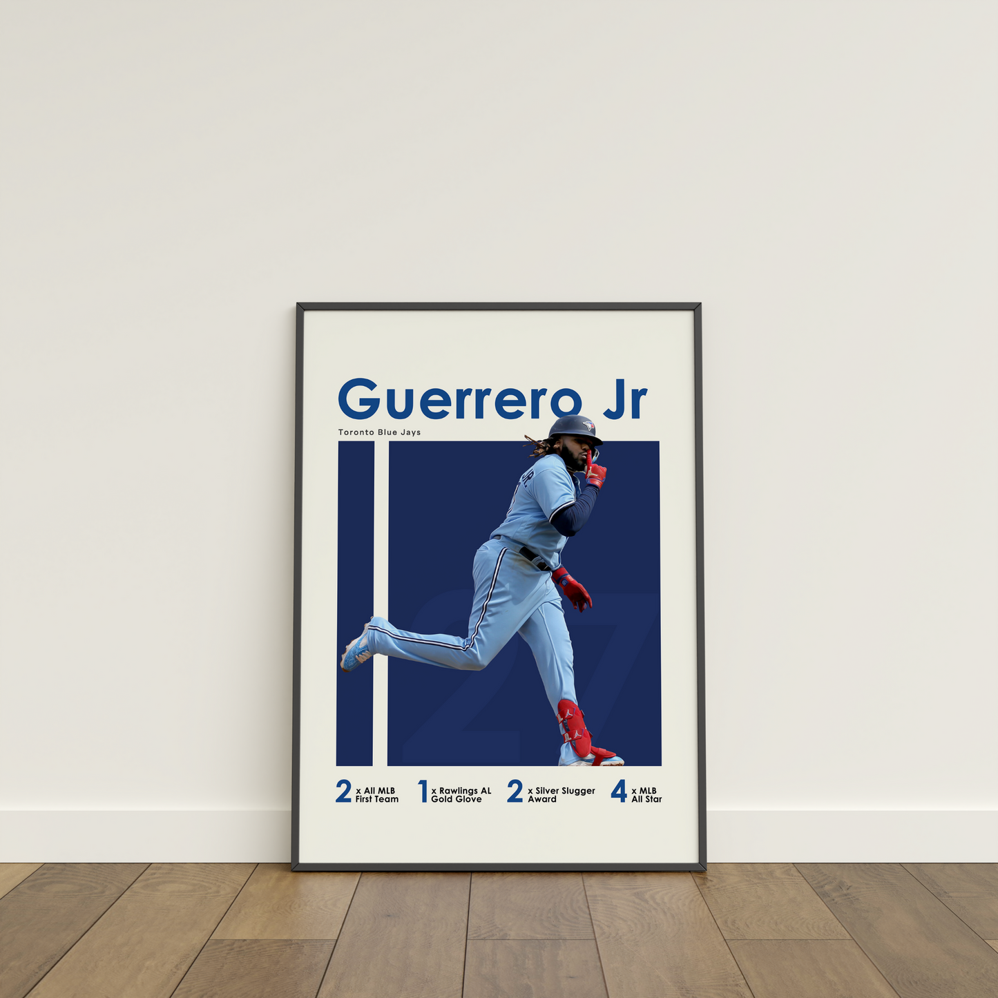 framed poster mockup leaning on a white wall. poster of baseball player vladimir guerrero jr celebrating for the Toronto Blue Jays.