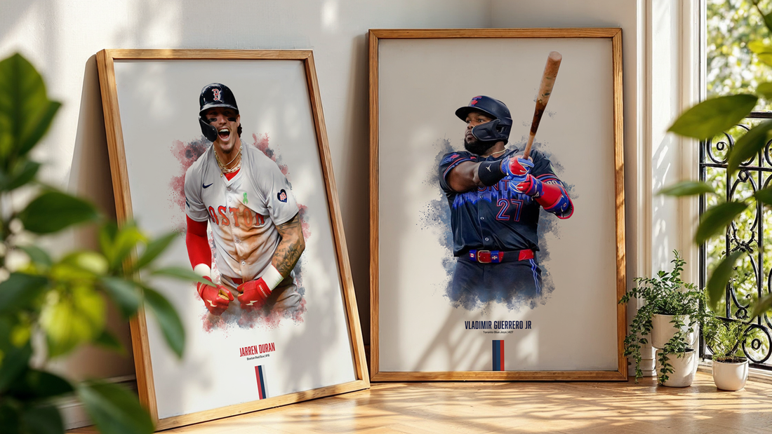 two framed baseball posters leaning on a wall next to a plant