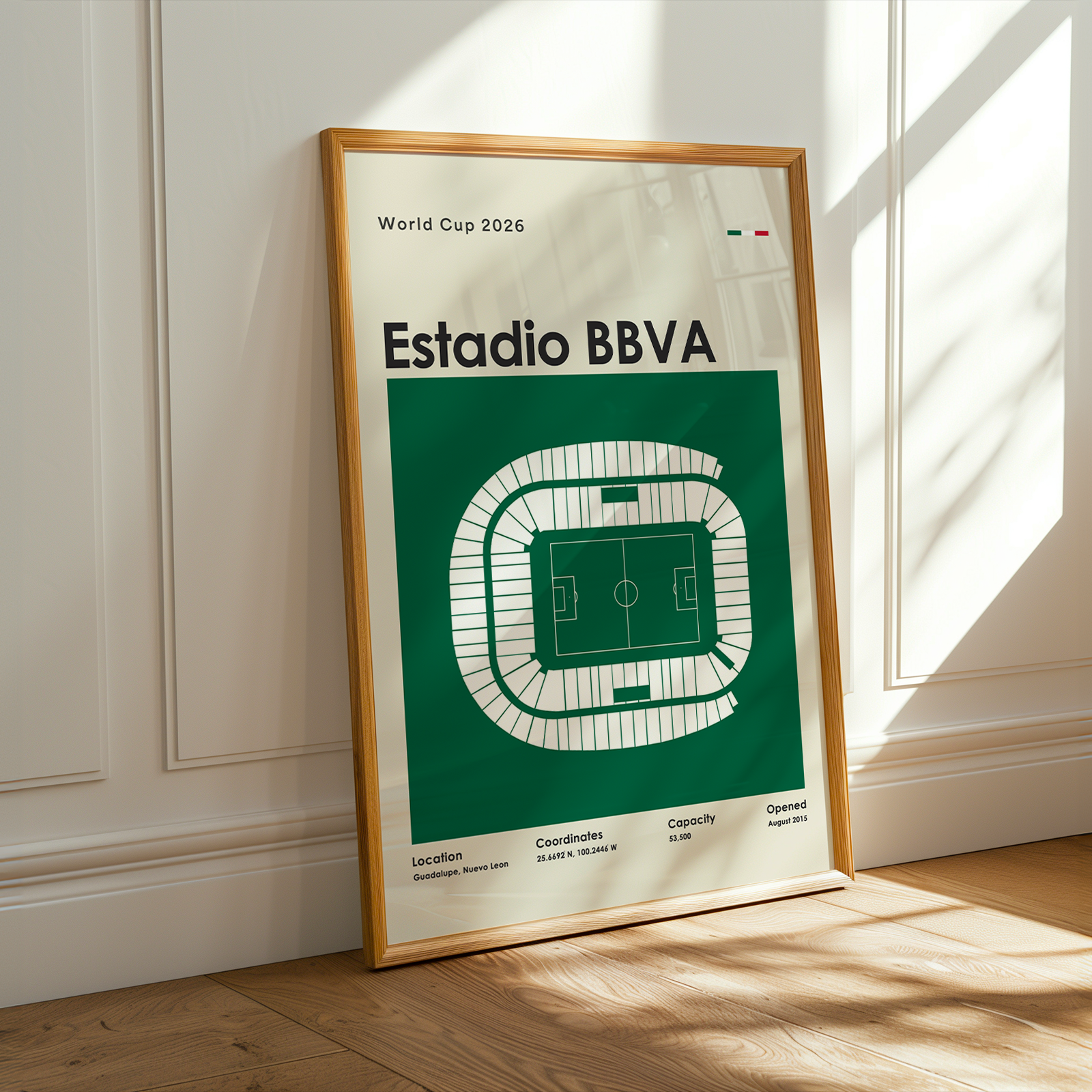 Framed poster of Estadio BBVA with World Cup 2026 text on a wall.