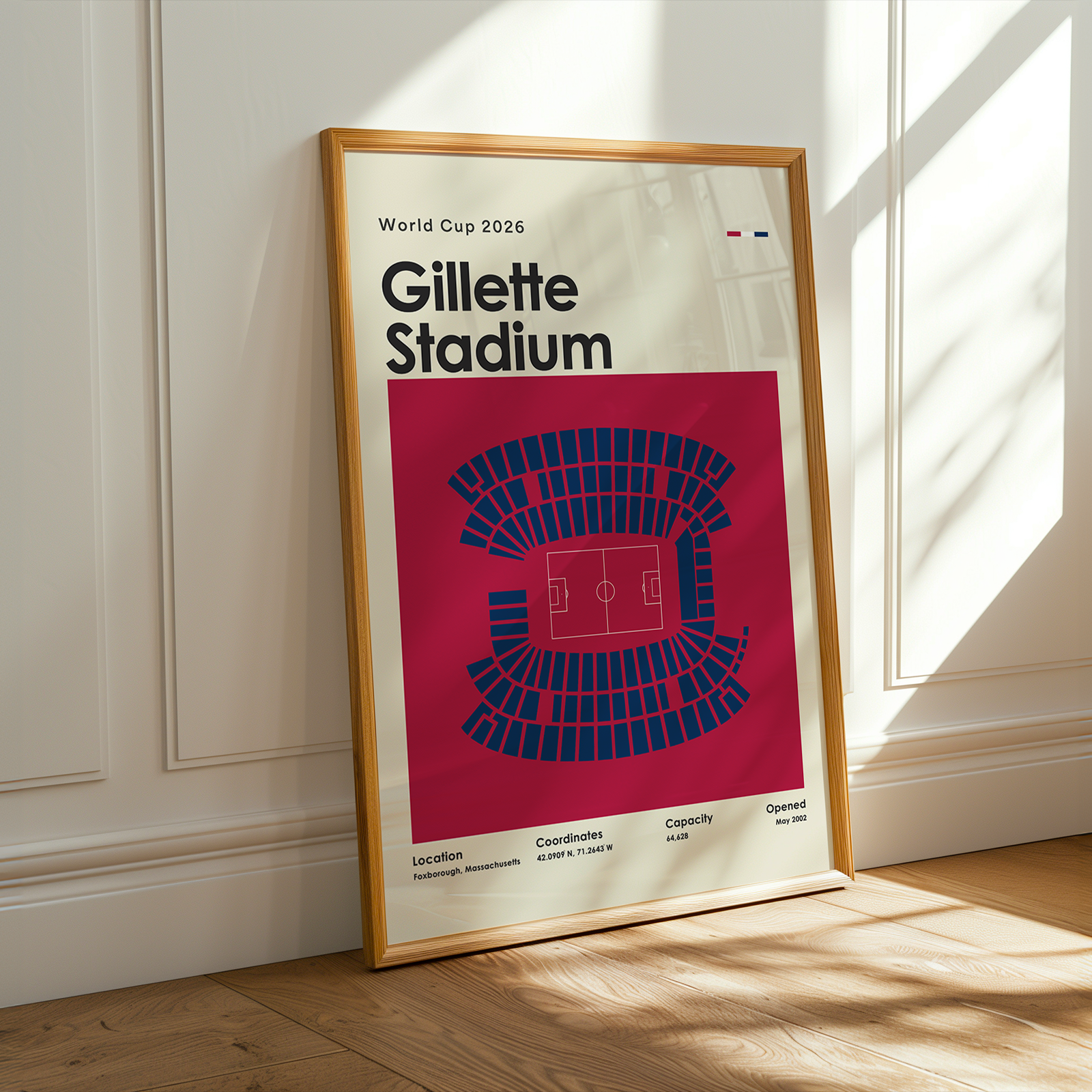 Framed poster of Gillette Stadium for World Cup 2026 on a wall.