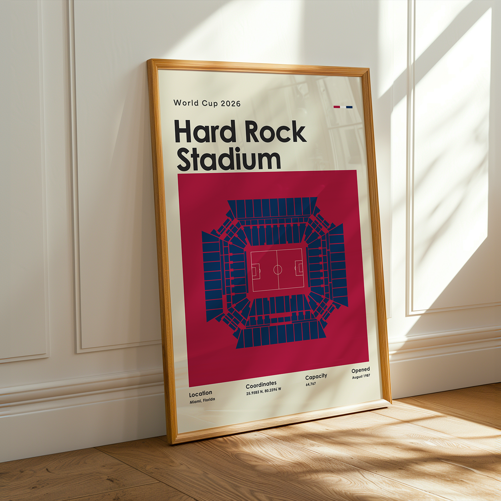 Framed poster of Gillette Stadium for World Cup 2026 on a wall.