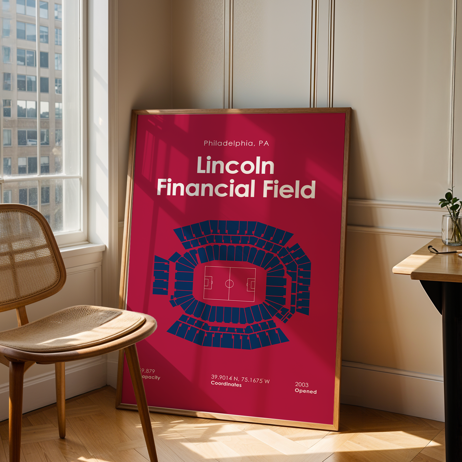 Poster of Lincoln Financial Field in a room with a chair and table.