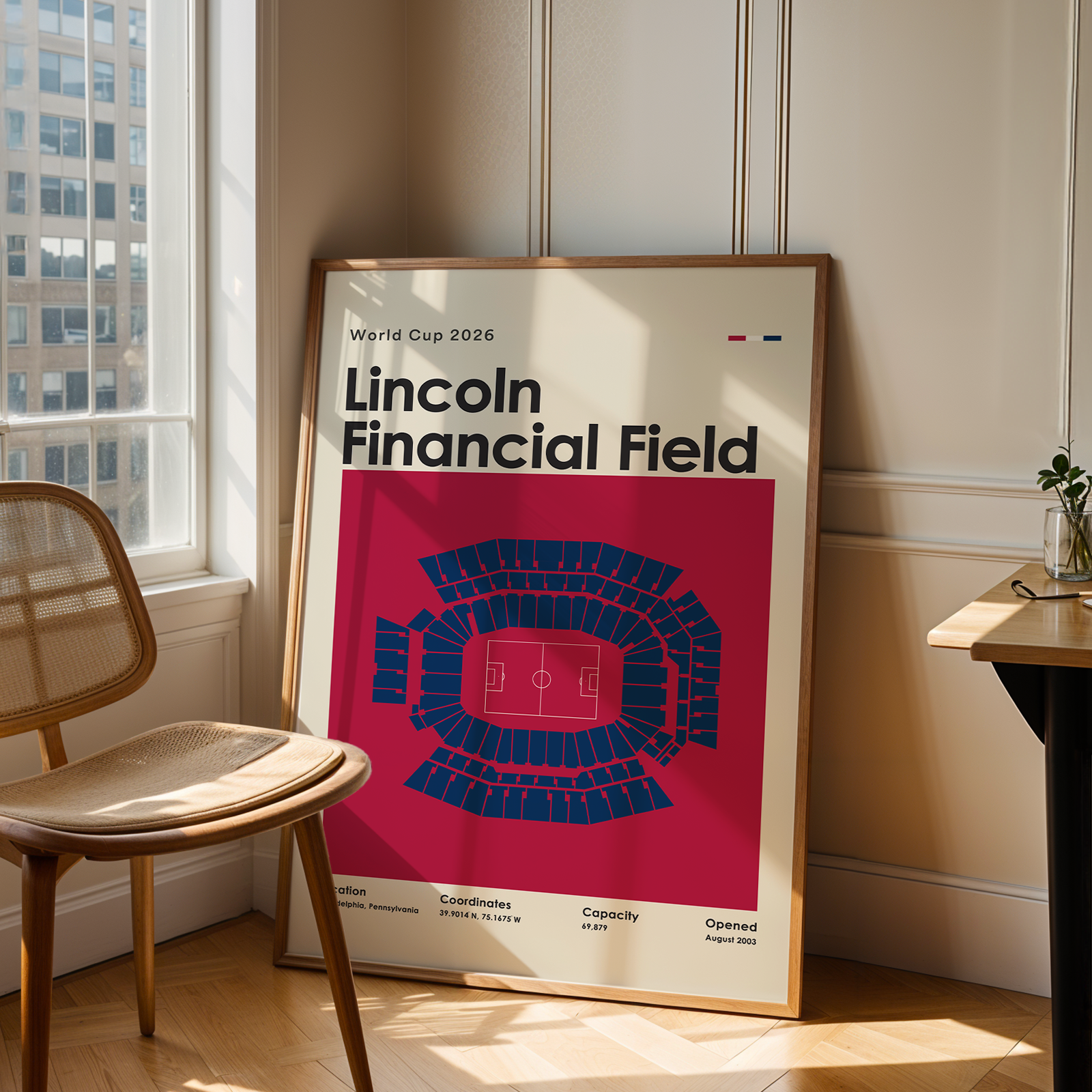 Poster of Lincoln Financial Field in a room with a chair and table.