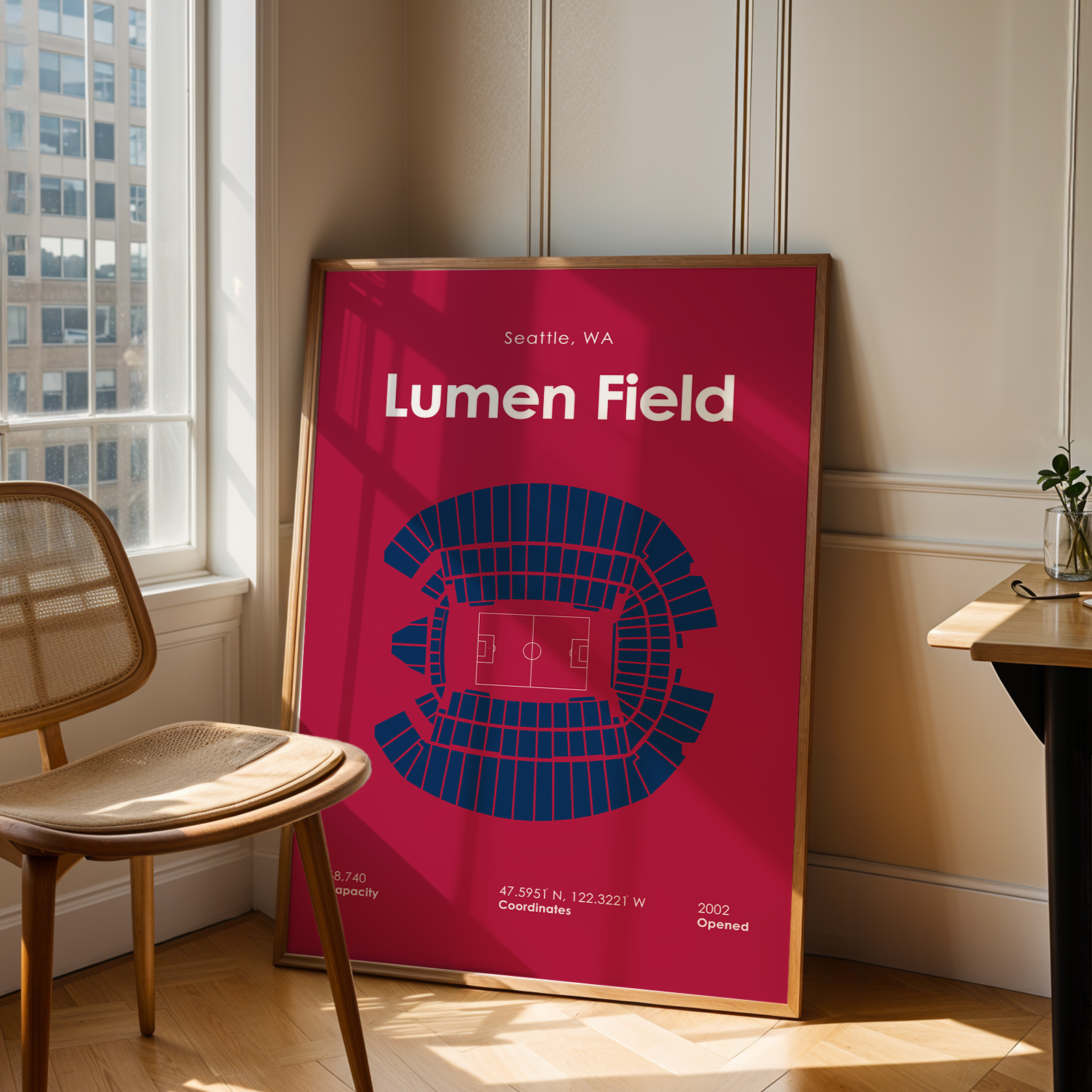 Poster of Lumen Field in a room with a chair and table.