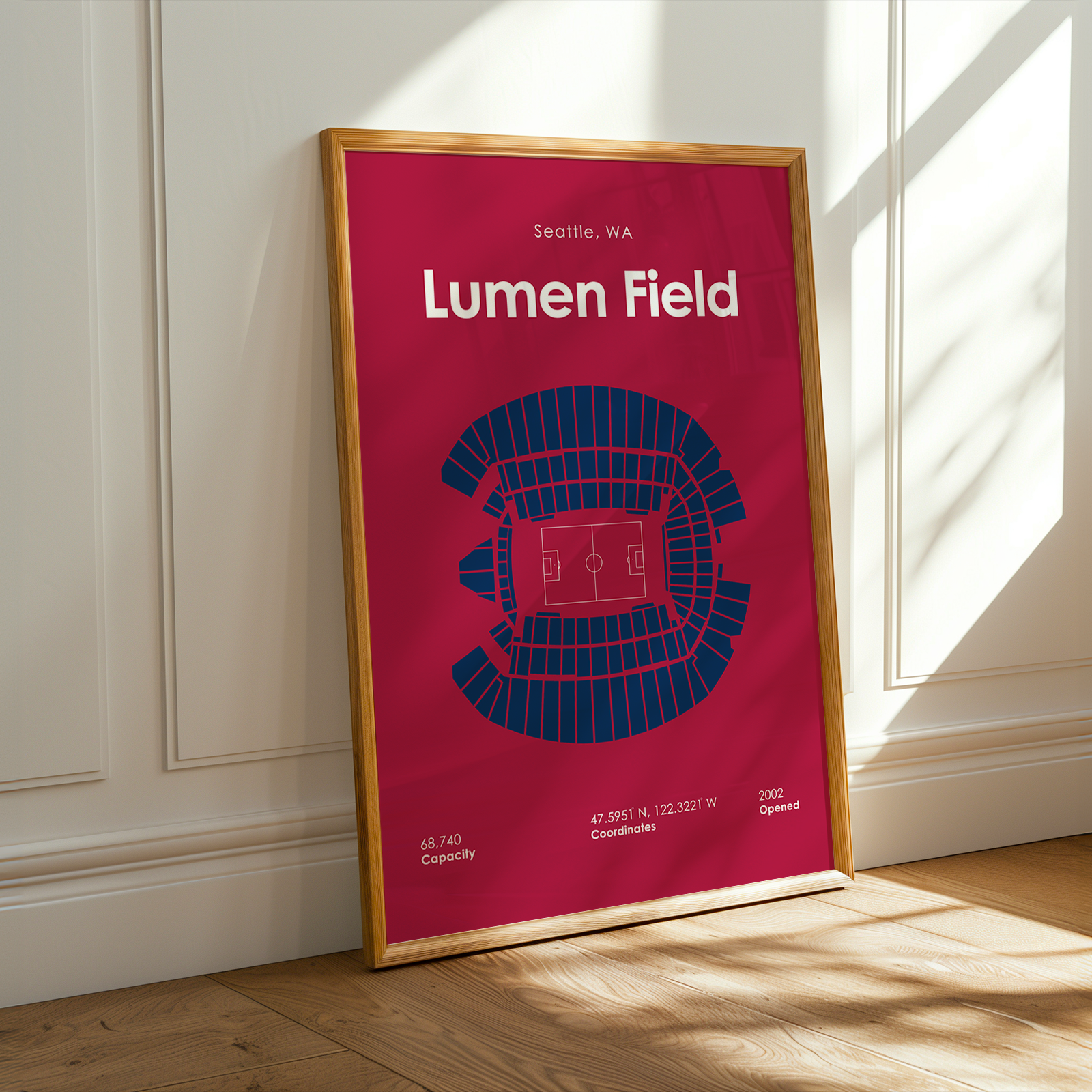 Framed poster of Lumen Field with seating chart on a wall.