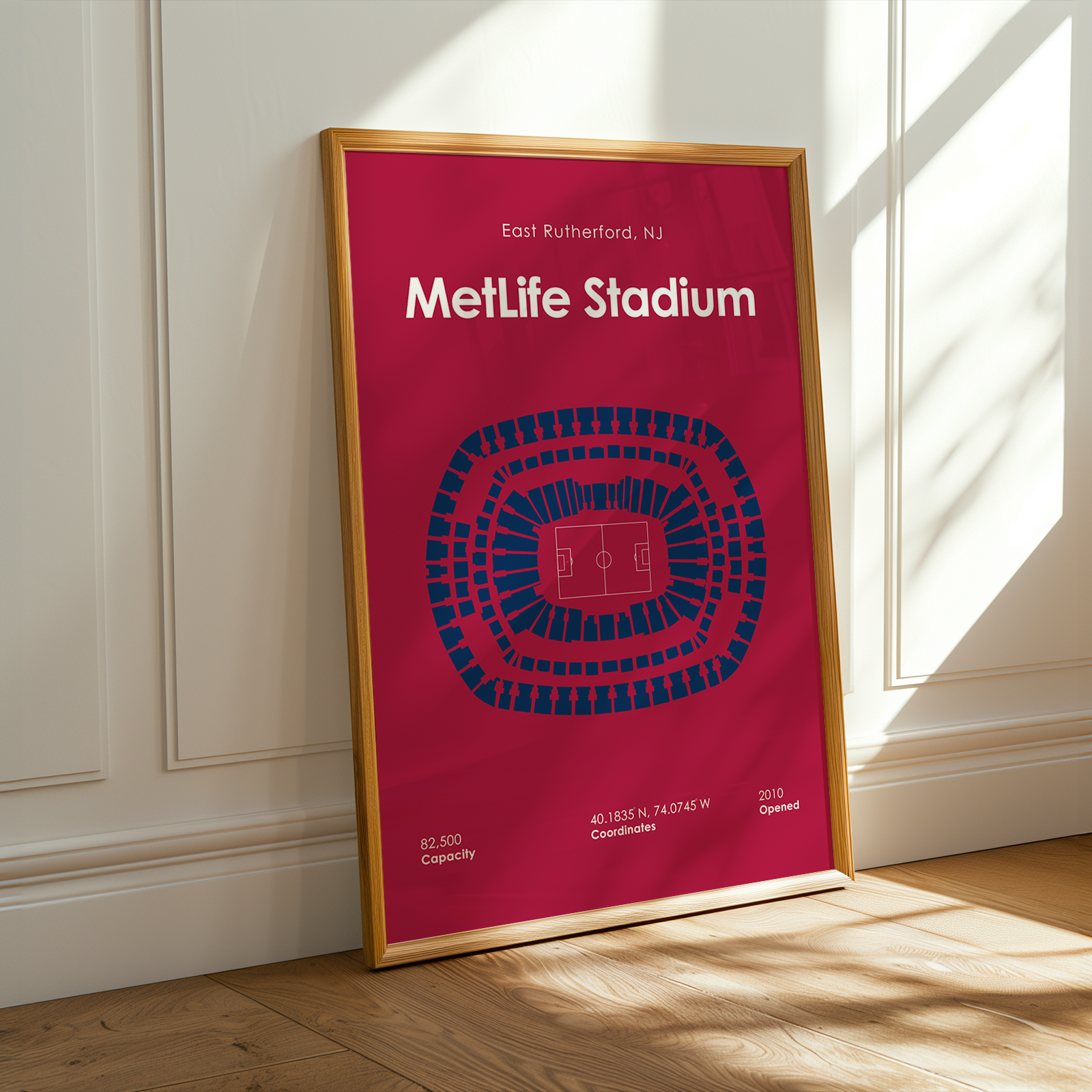 Framed poster of MetLife Stadium layout on a wall.