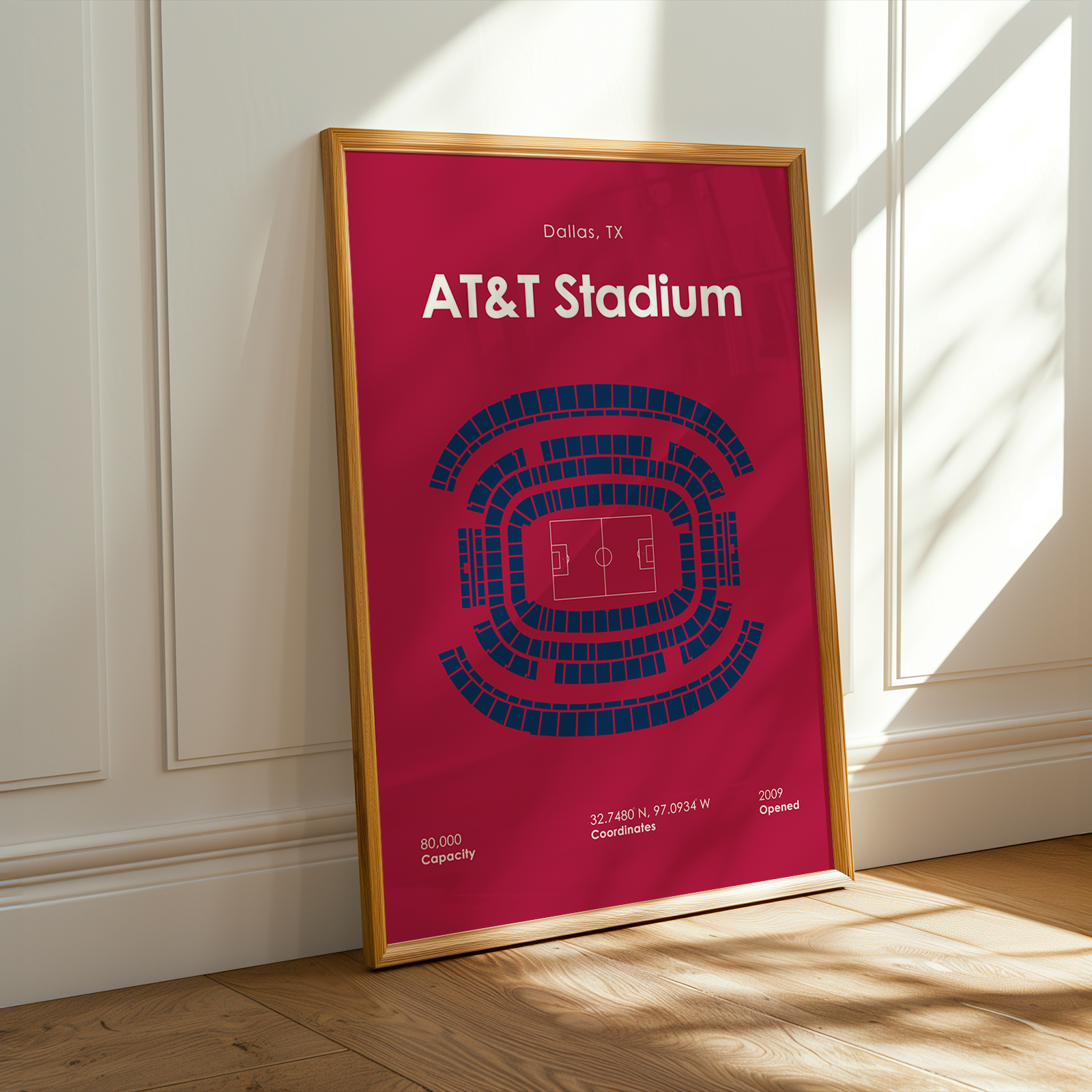 Framed poster of AT&T Stadium layout on a wall.