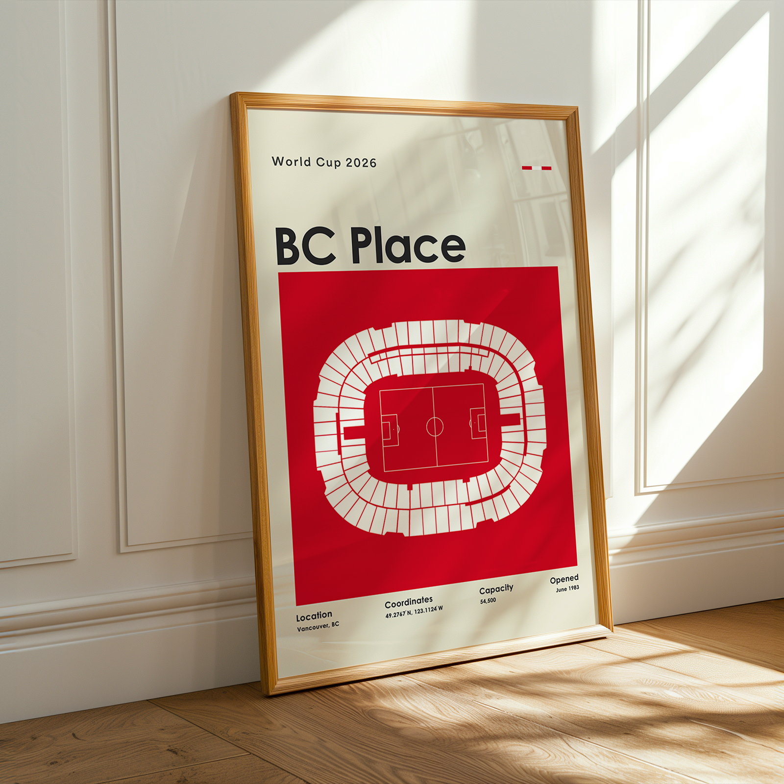 Framed poster of BC Place stadium layout on a wall.
