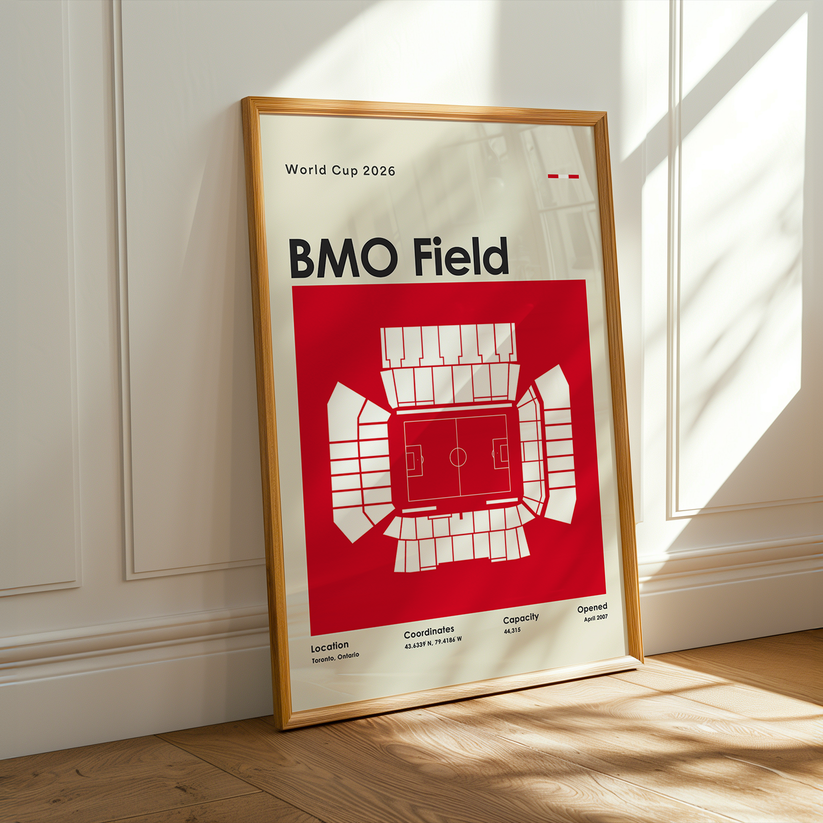 Framed poster of BMO Field with stadium layout on a white wall.