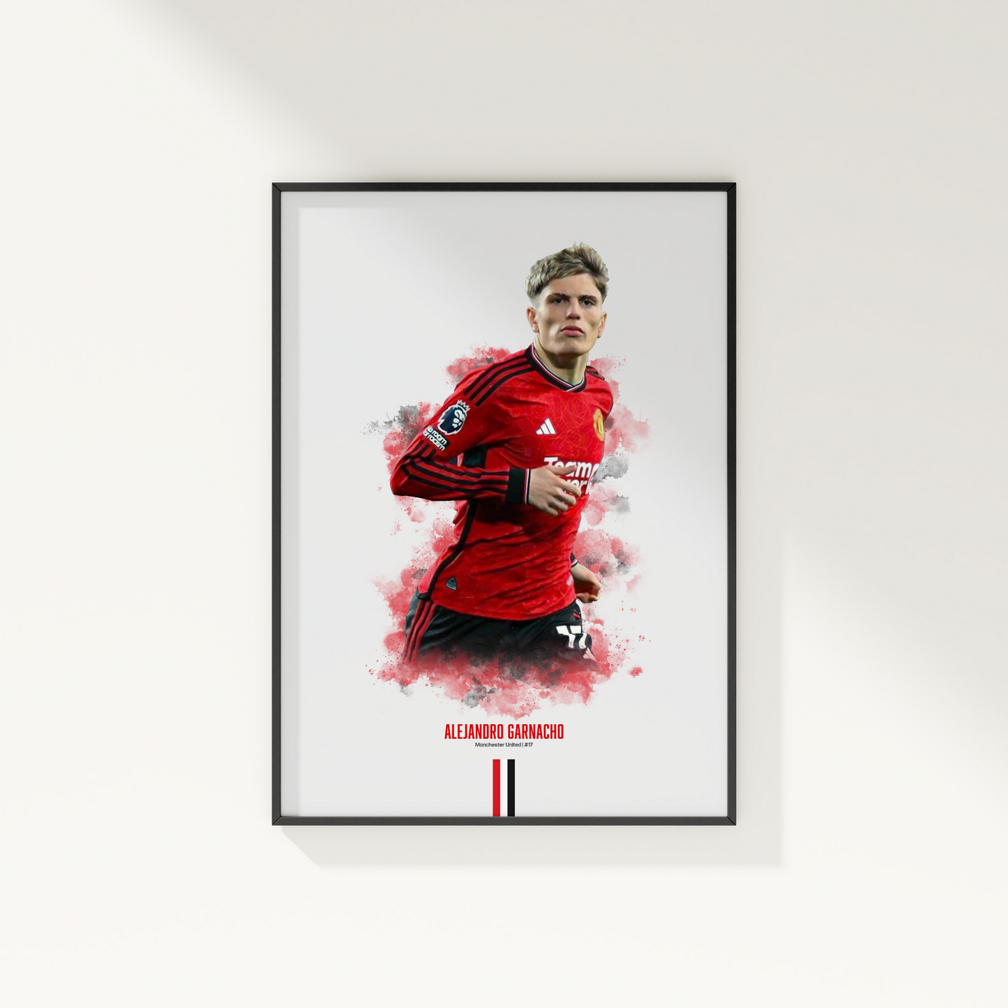 framed poster mockup of soccer player alejandro garnacho hanging on a white wall